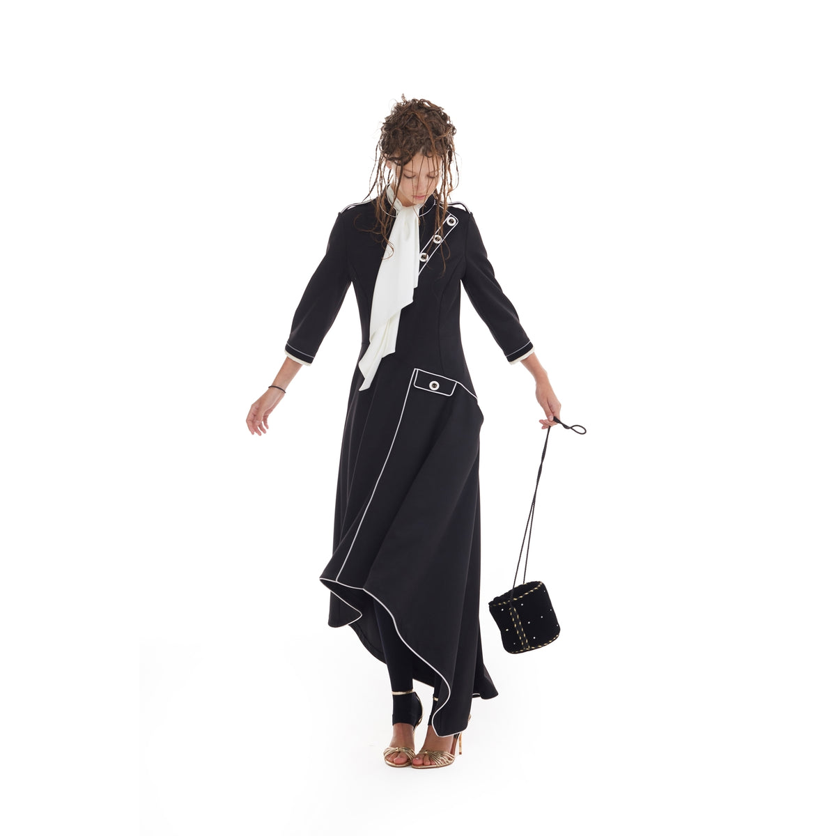 JULIA ALLERT black A-line asymmetric hem dress worn by model holding small bag, buy at DOORS NYC