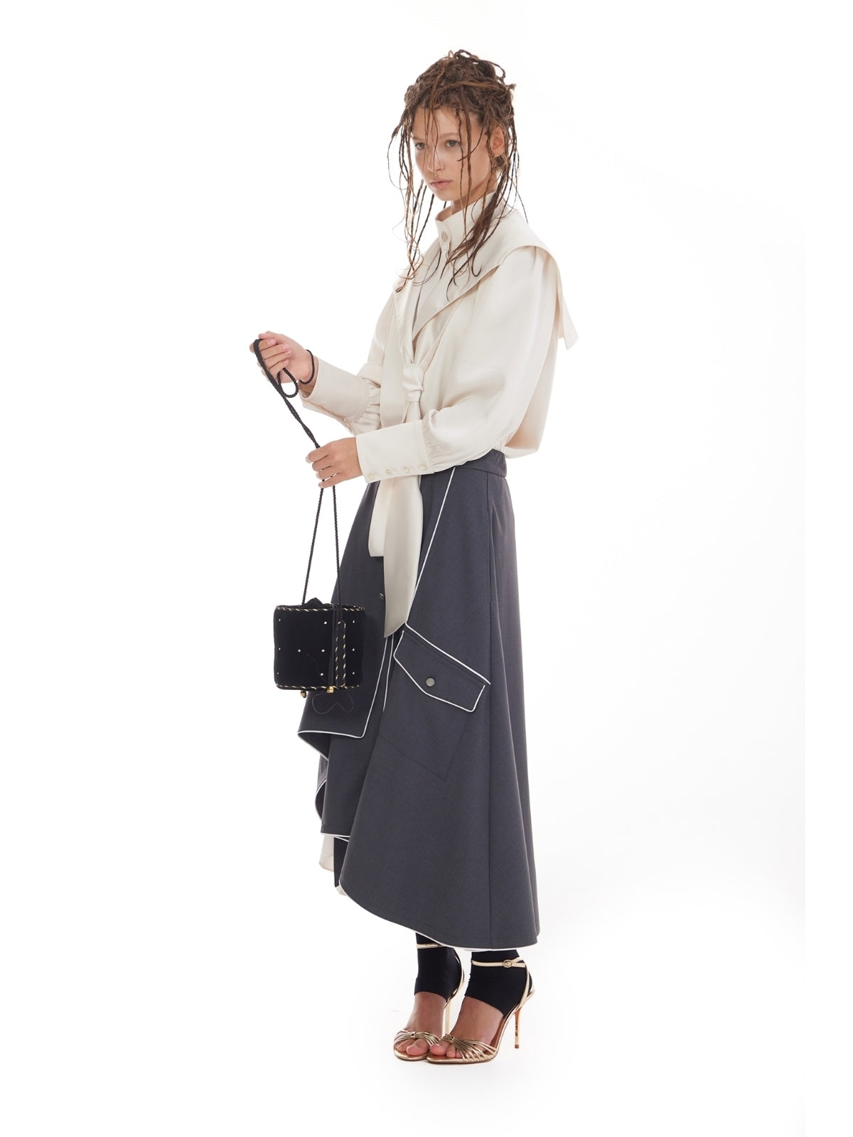 JULIA ALLERT dark gray asymmetrical midi skirt, model look with handbag, buy at DOORS NYC