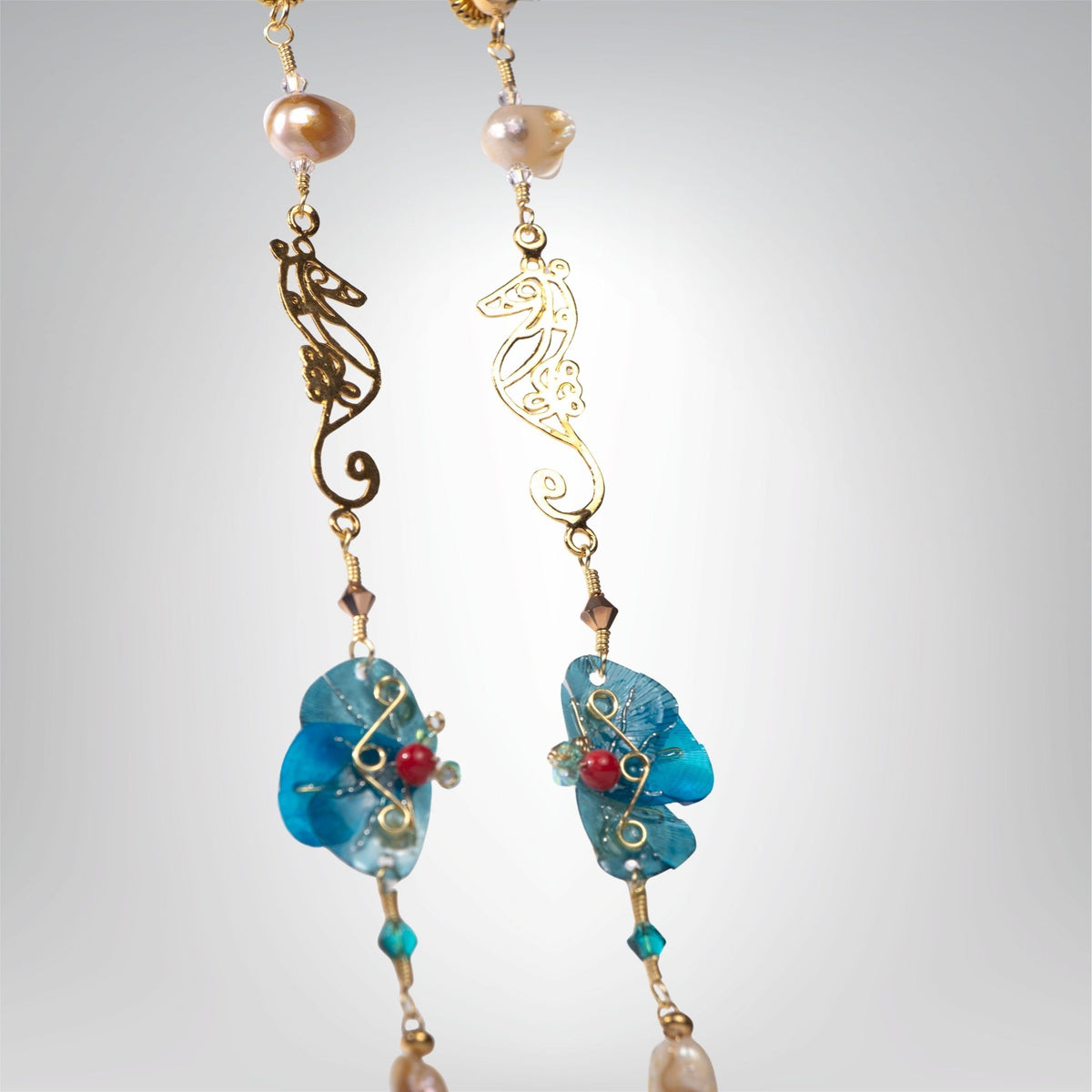 Seahorse earrings displayed design by Alma Dos Mares