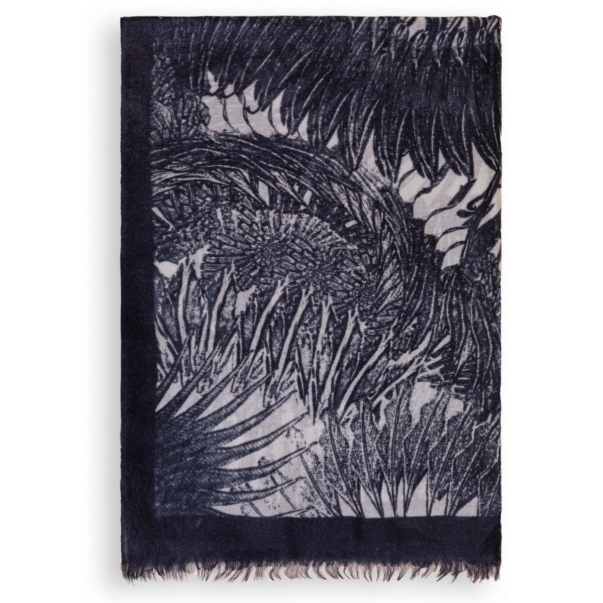 The Black Ella Monochrome Stole by OO-TO is a rectangular cashmere accessory handcrafted in Nepal, featuring overlapping black and gray leafy patterns, a solid dark border, and fringed edges—an ethical luxury piece with timeless style.