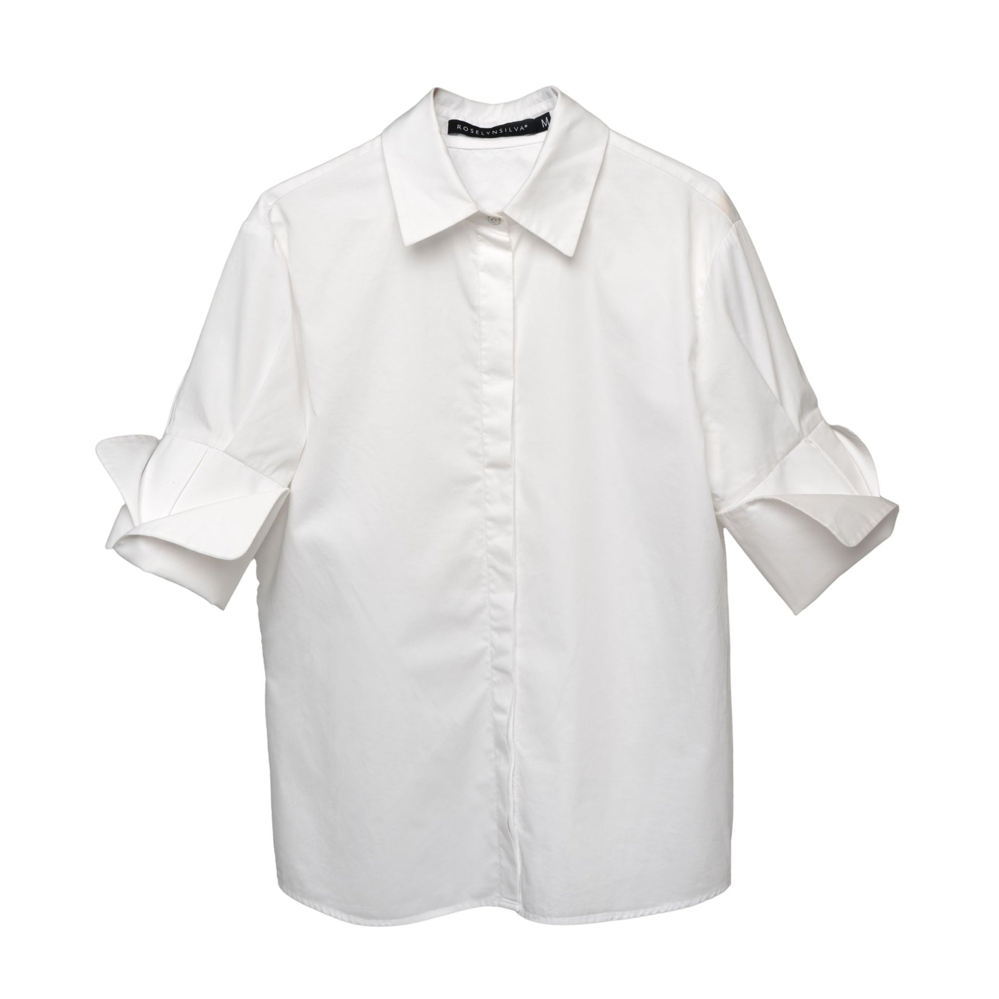 White shirt with cuffed sleeves on a white background