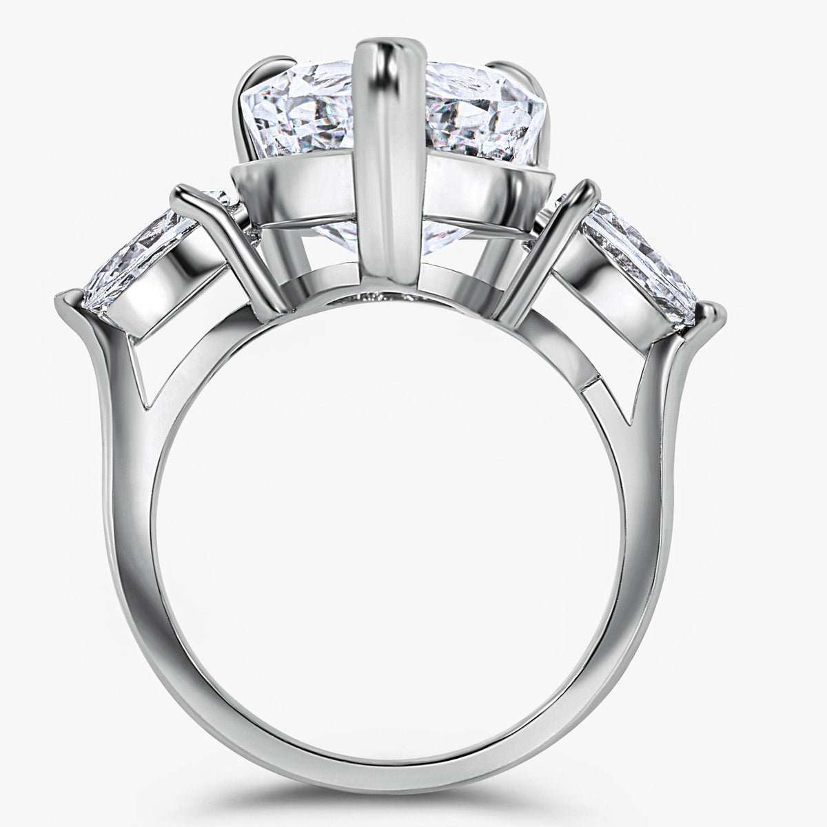 Silver ring with three diamond-like stones on a white background