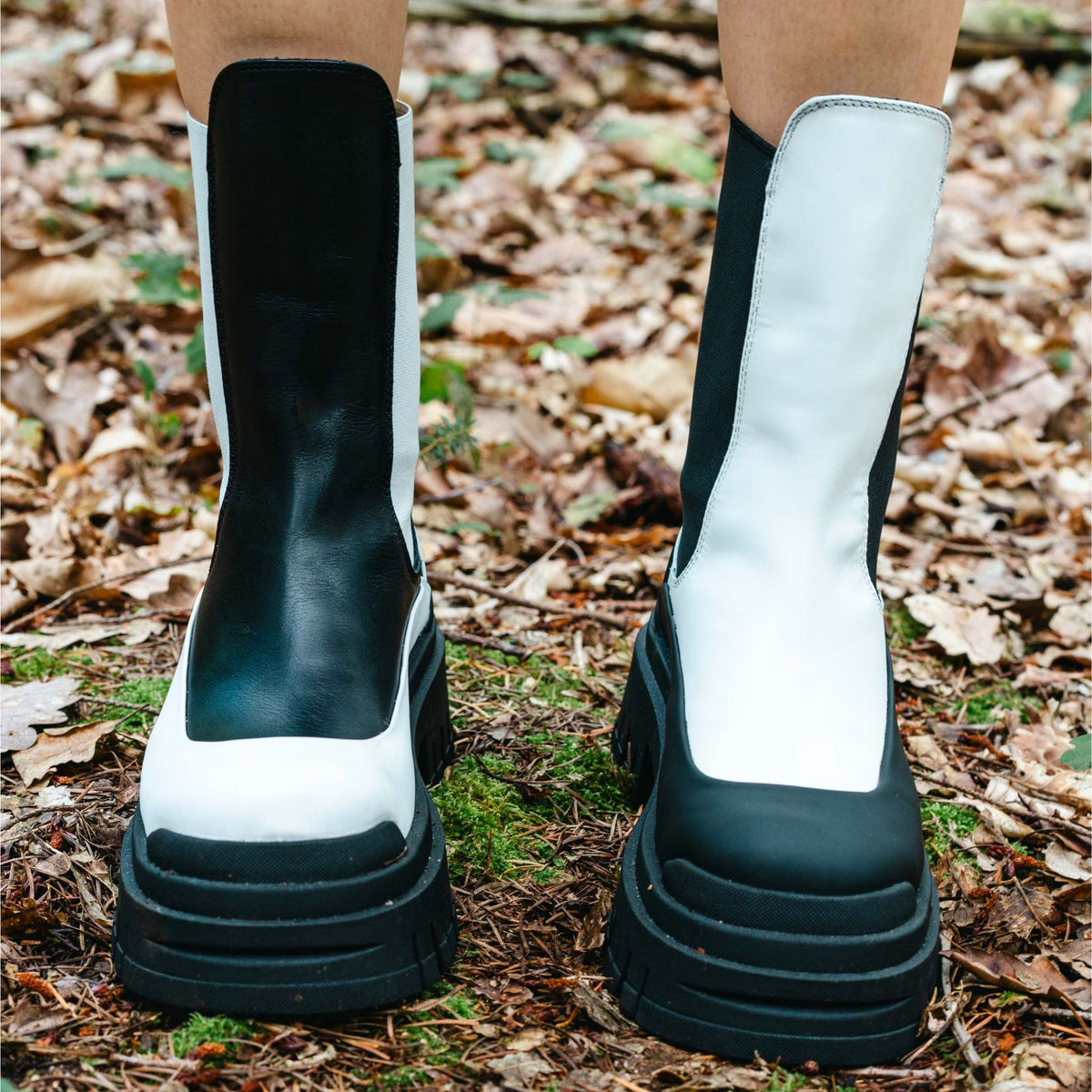 Black and white boots on a natural background