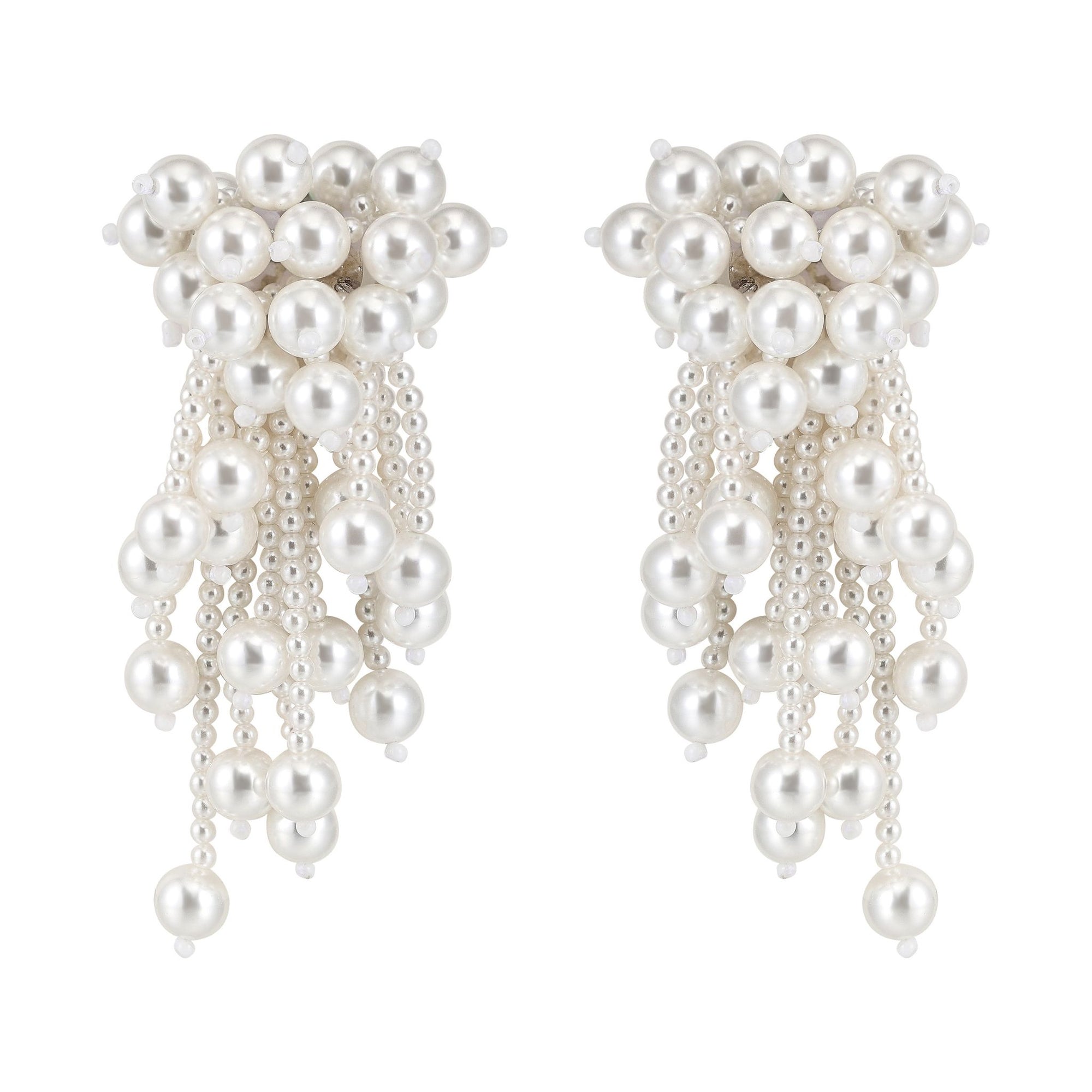 Pair of pearl earrings with dangling beads on a white background