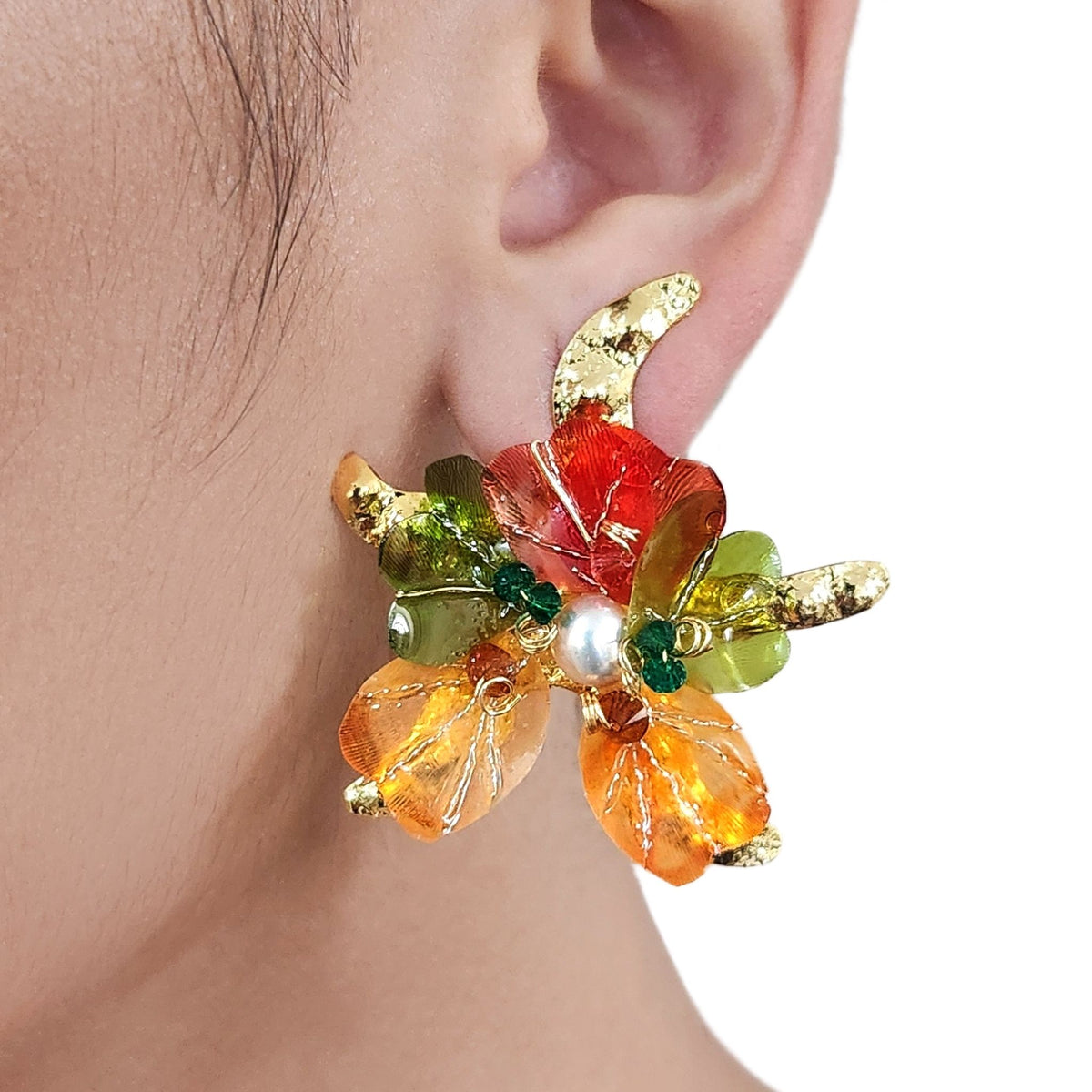 Model ear wearing starfish earring  in close up