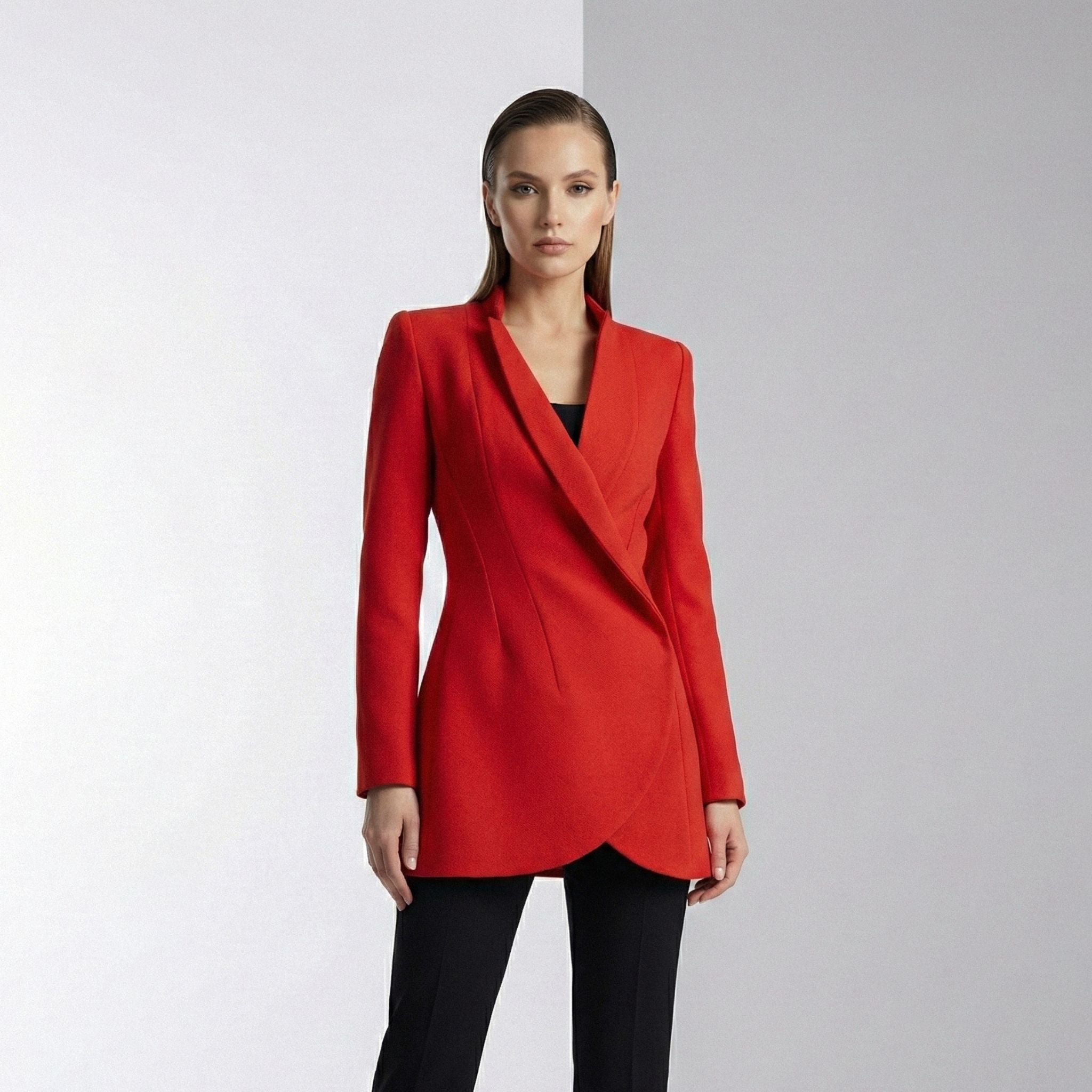Woman wearing a red blazer against a white background