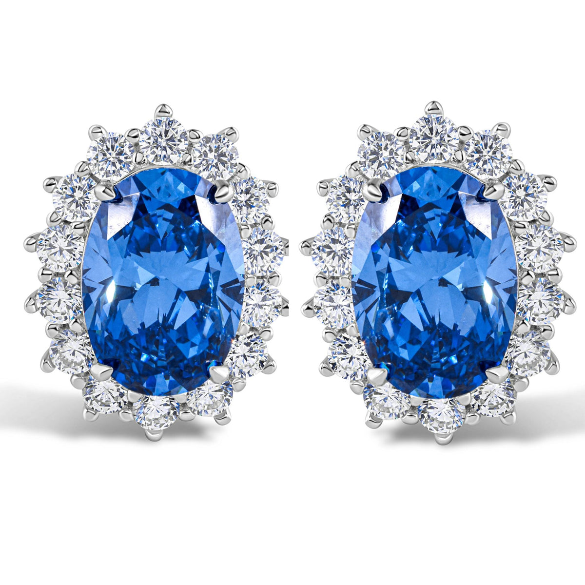 Pair of blue gemstone earrings with silver accents on a white background