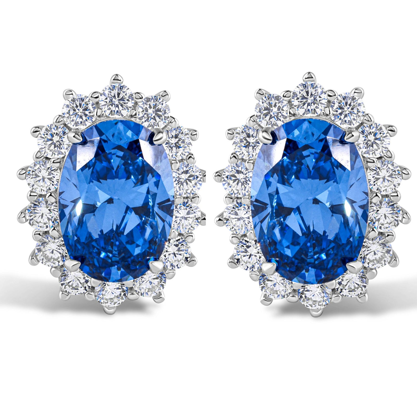 Pair of blue gemstone earrings with silver accents on a white background