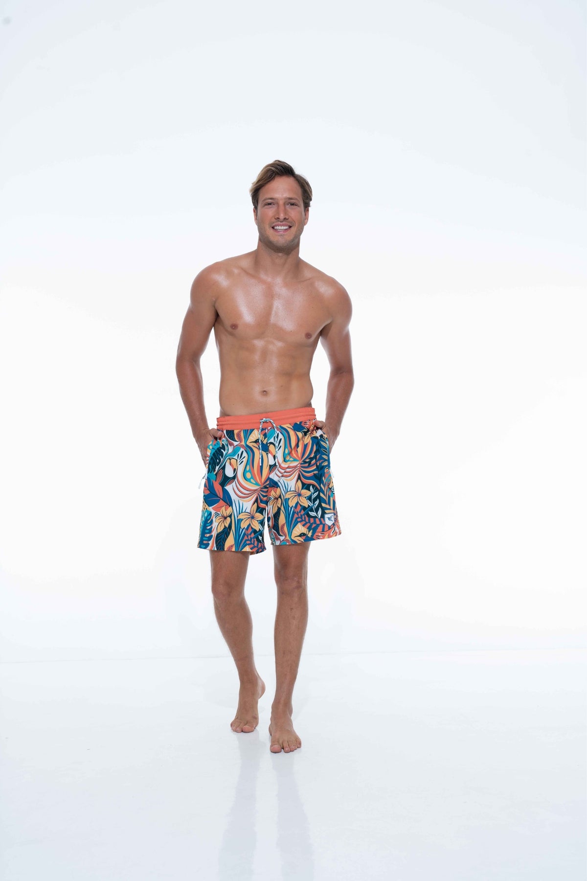 Model wearing eco-friendly jungle print swim shorts