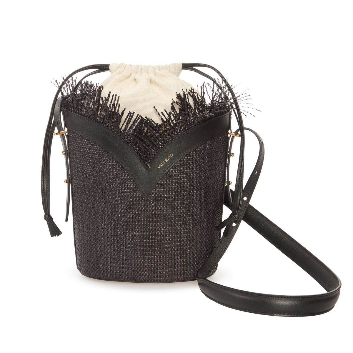 Black woven handbag with a decorative strap on a white background