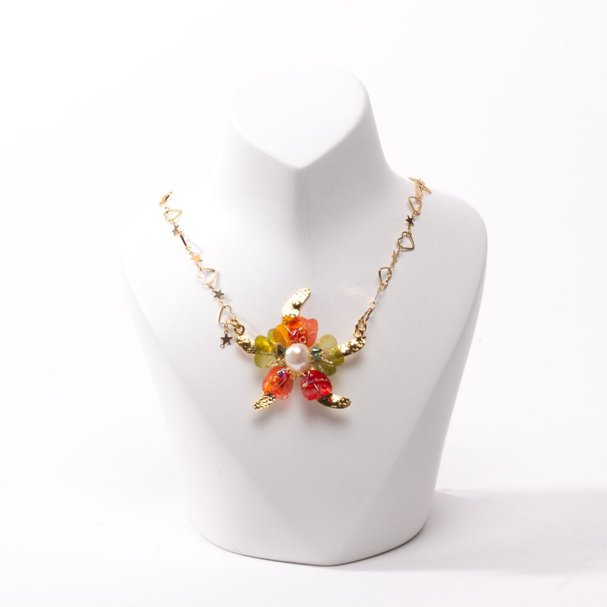 Model chest wearing neckalace in close up