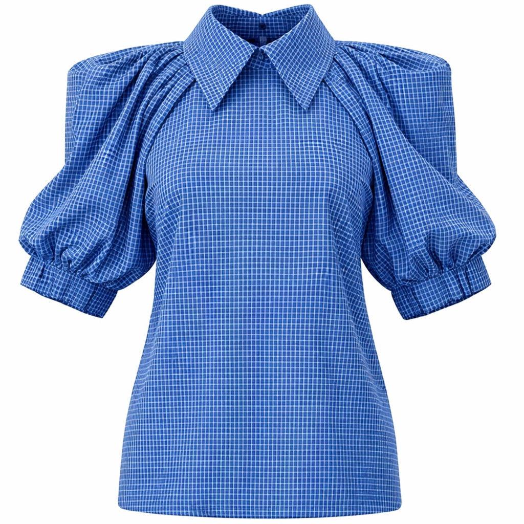 The Designer Plaid Puff Sleeve Blouse - Blue by JULIA ALLERT features a pointed collar, voluminous puffed sleeves with gathered cuffs, a fitted waist, and a bold checked pattern throughout.