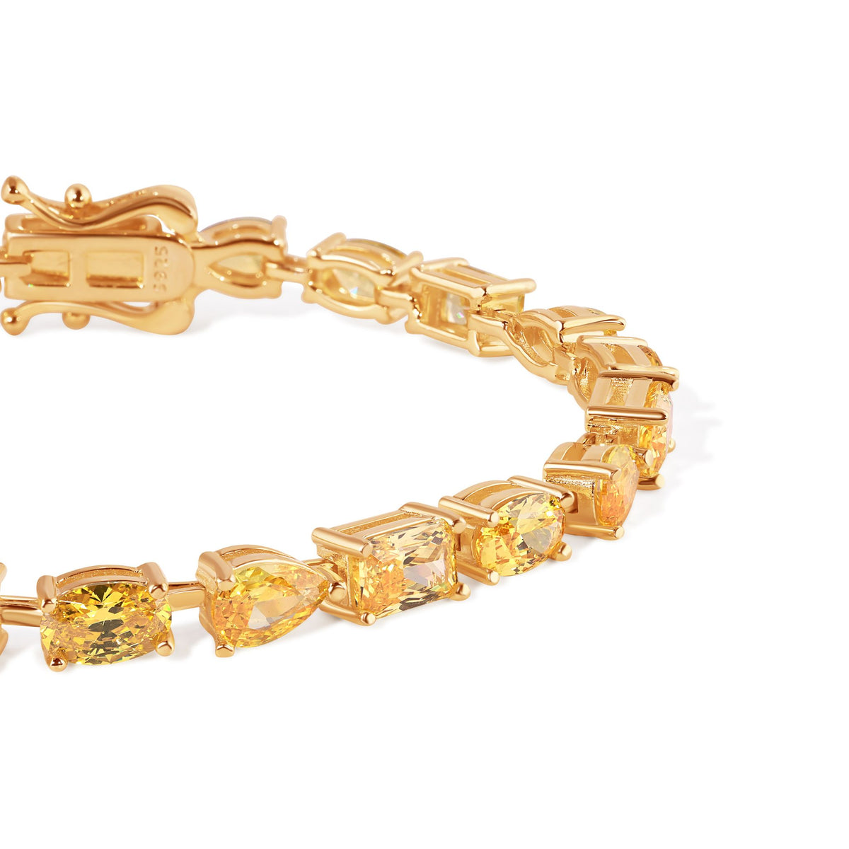 Gold bracelet with yellow gemstones on a white background