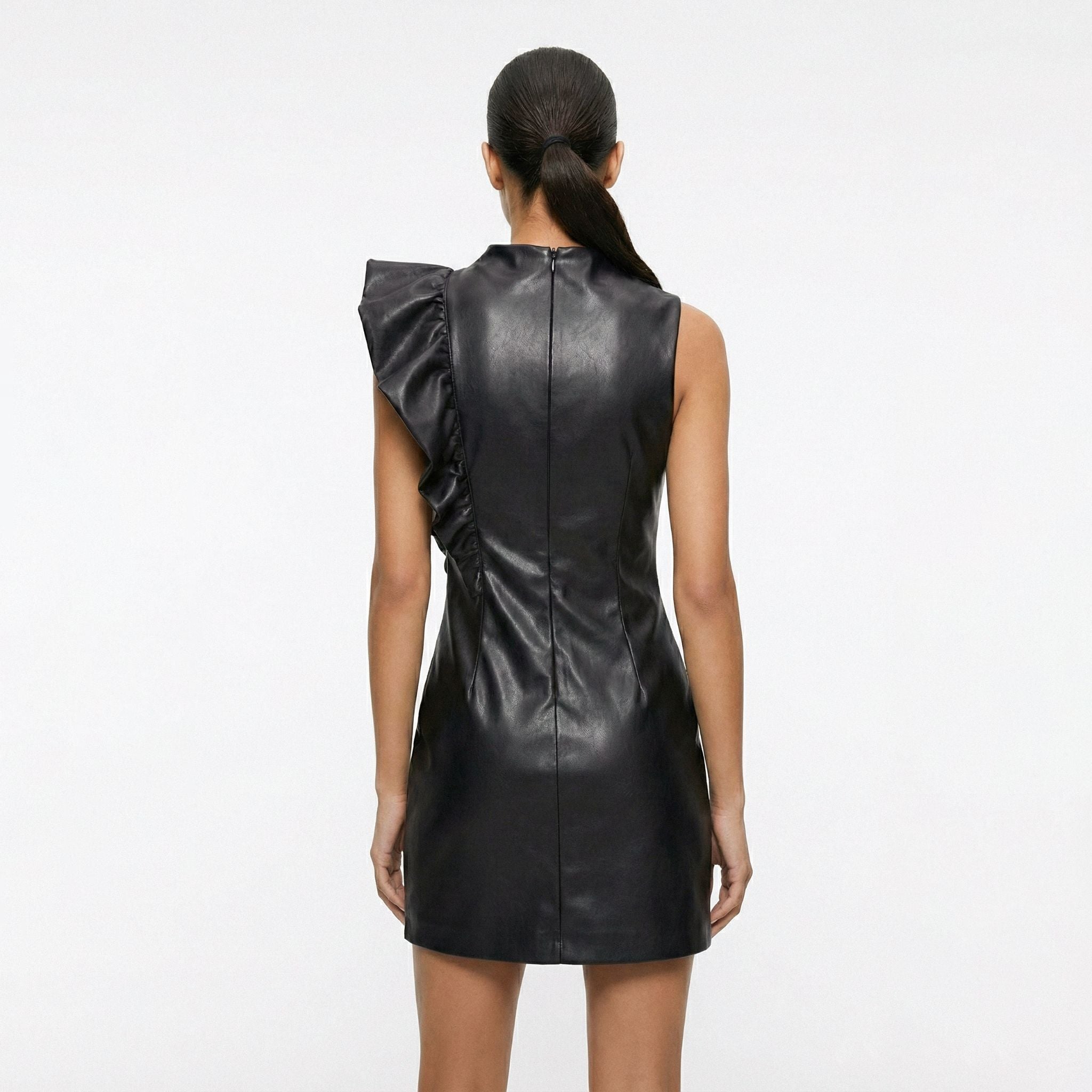 Black leather dress with ruffled shoulder on a white background