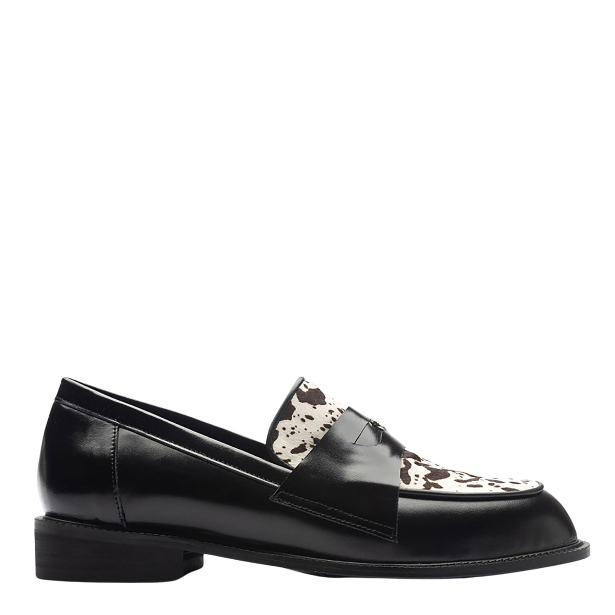 The THEN Black Leather Loafers with Cowhide Print Vamp are handmade in Korea, featuring a low heel and eye-catching cowhide-print vamp, shown in a side view against a white background.