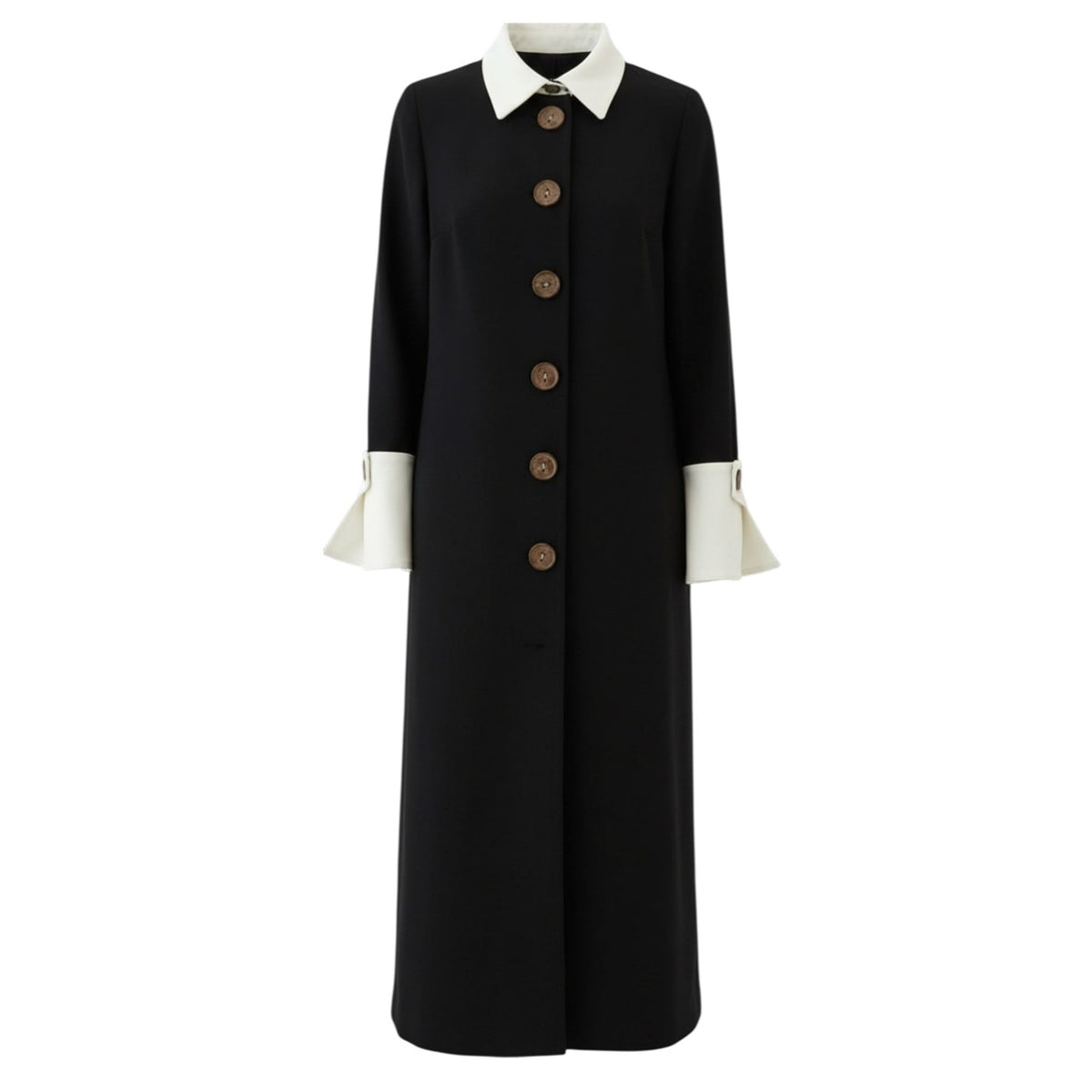 The JULIA ALLERT Monochrome Midi Shirt Dress in black and white features a long coat-style design with large brown buttons, wide white cuffs, and a pointed collar, shown against a plain white background.
