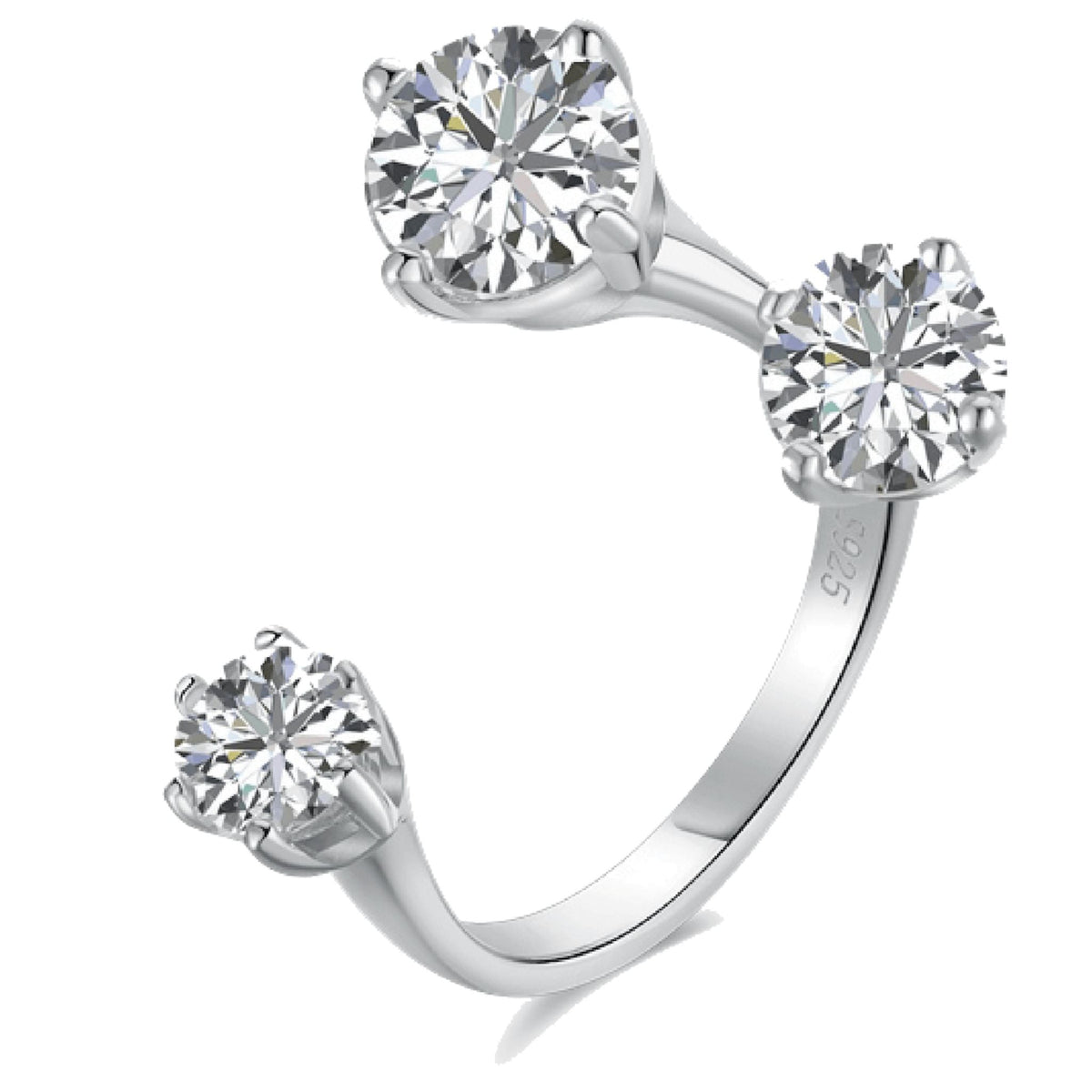 Silver ring with three clear gemstones on a white background