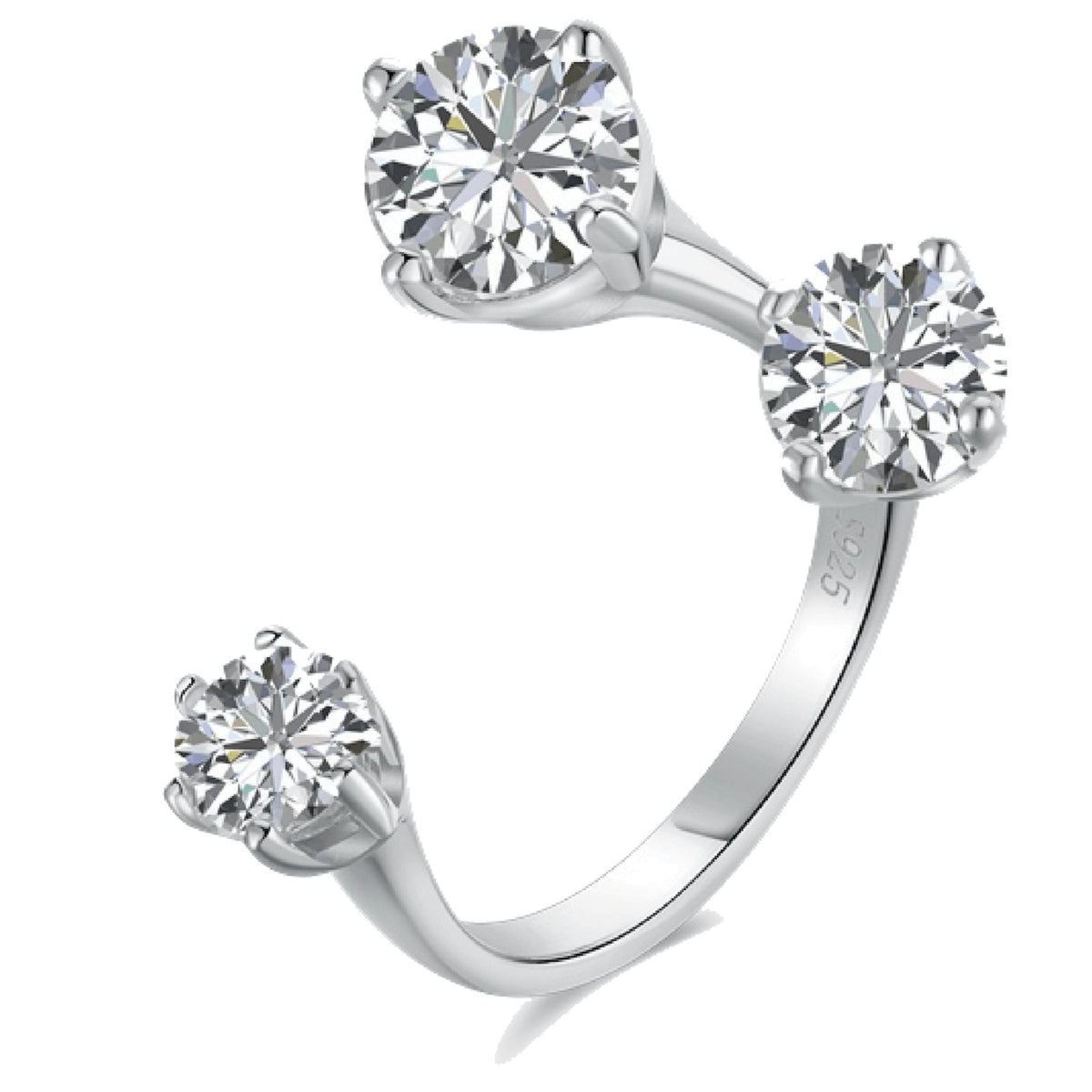 Silver ring with three clear gemstones on a white background