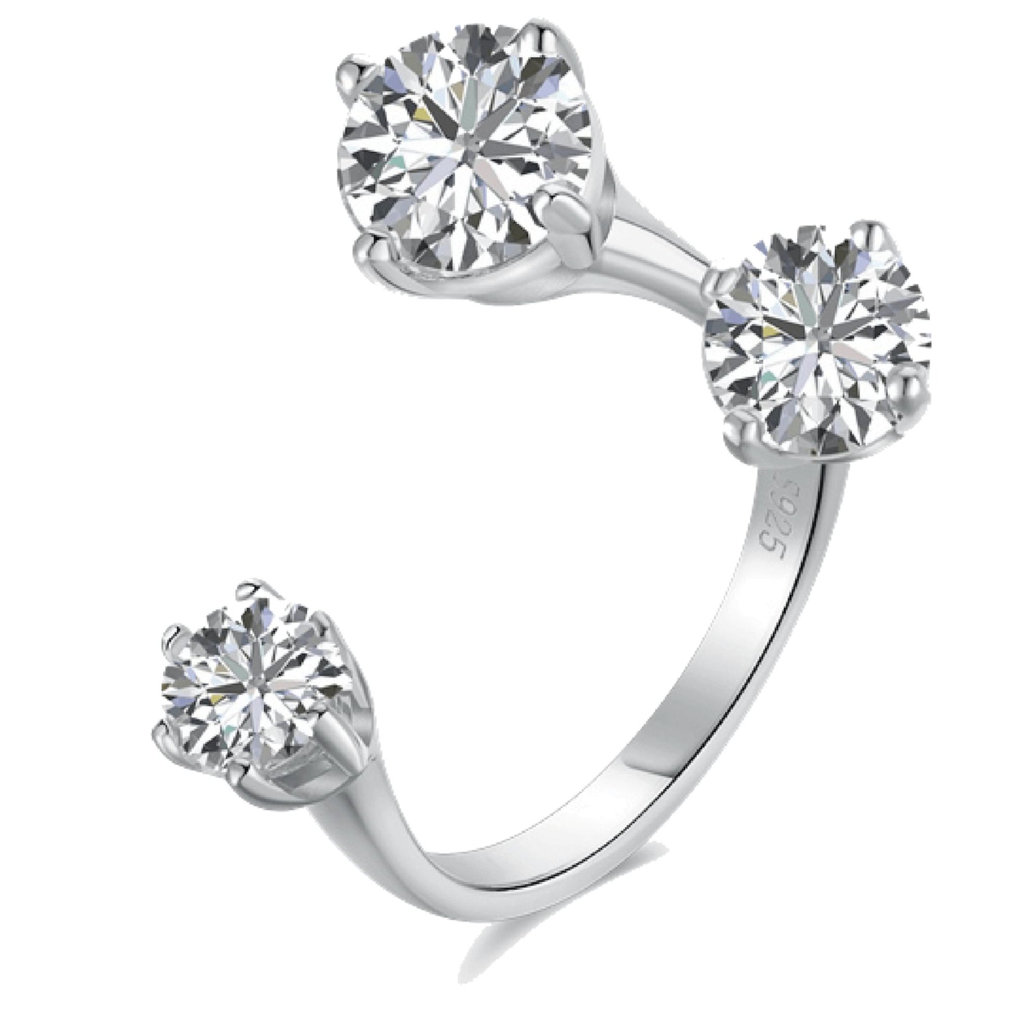 Silver ring with three clear gemstones on a white background