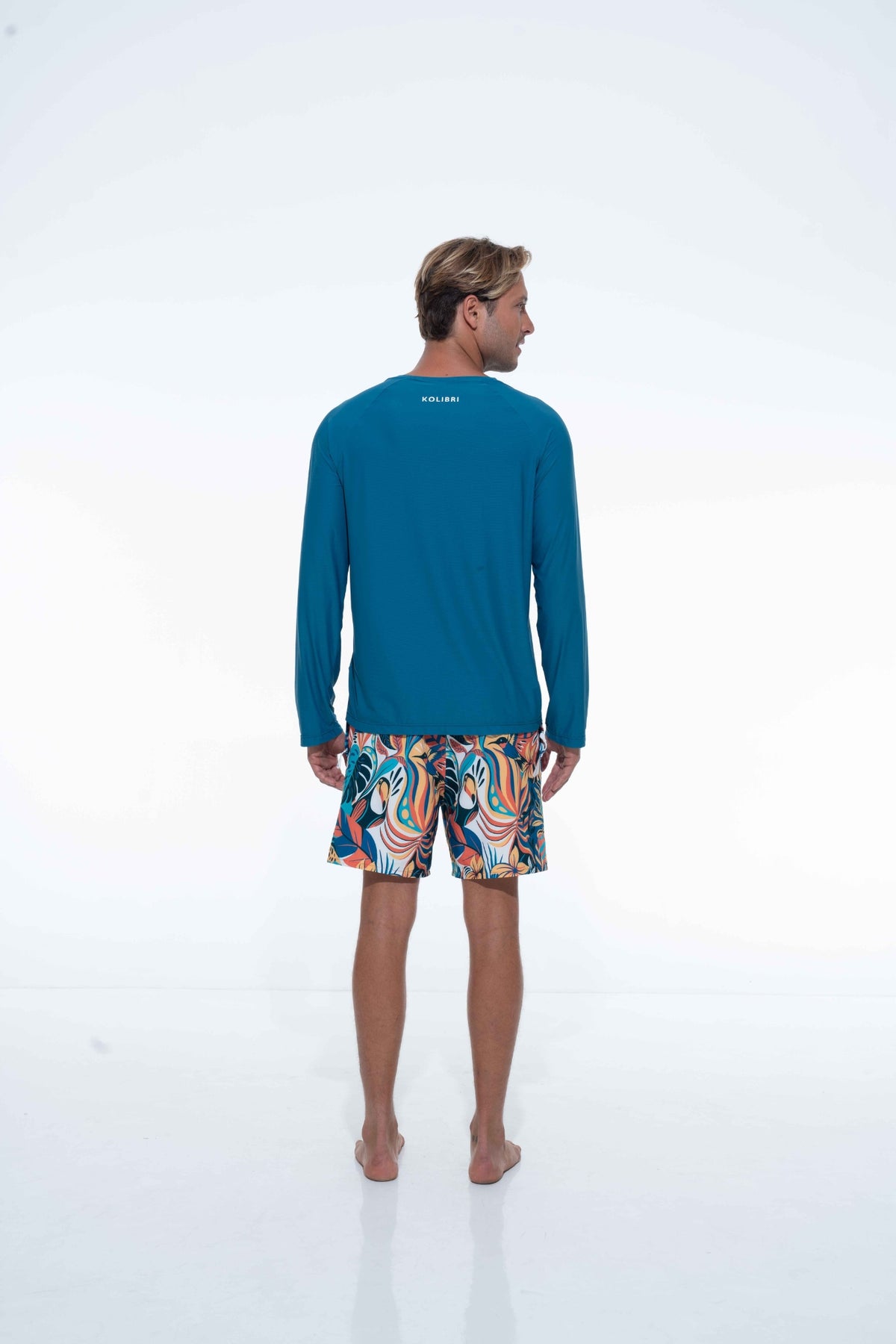 Model wearing deep ocean UPF long sleeve activity shirt