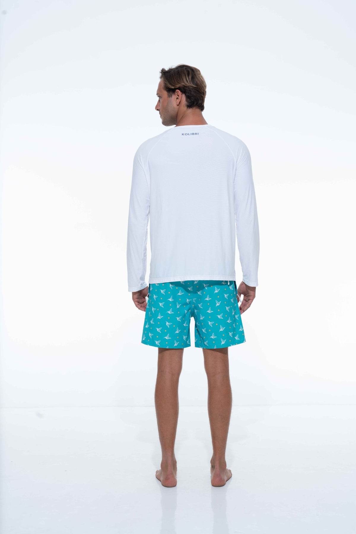 Model wearing white UPF long sleeve activity shirt