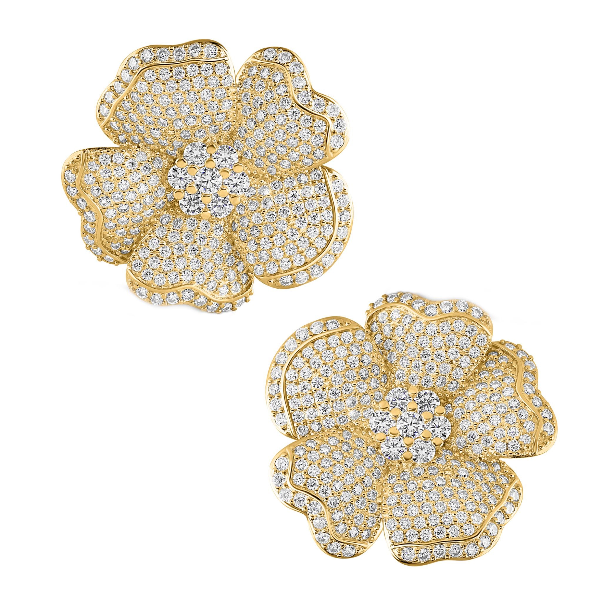 Gold and diamond flower-shaped earrings on a white background