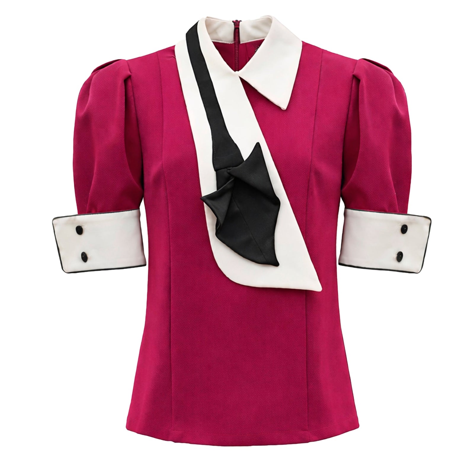 The Statement Blouse With White Collar And Cuffs in fuchsia by JULIA ALLERT features short sleeves, puffed shoulders, a white collar and cuffs with black buttons, and an elegant black and white decorative scarf draped on the front.
