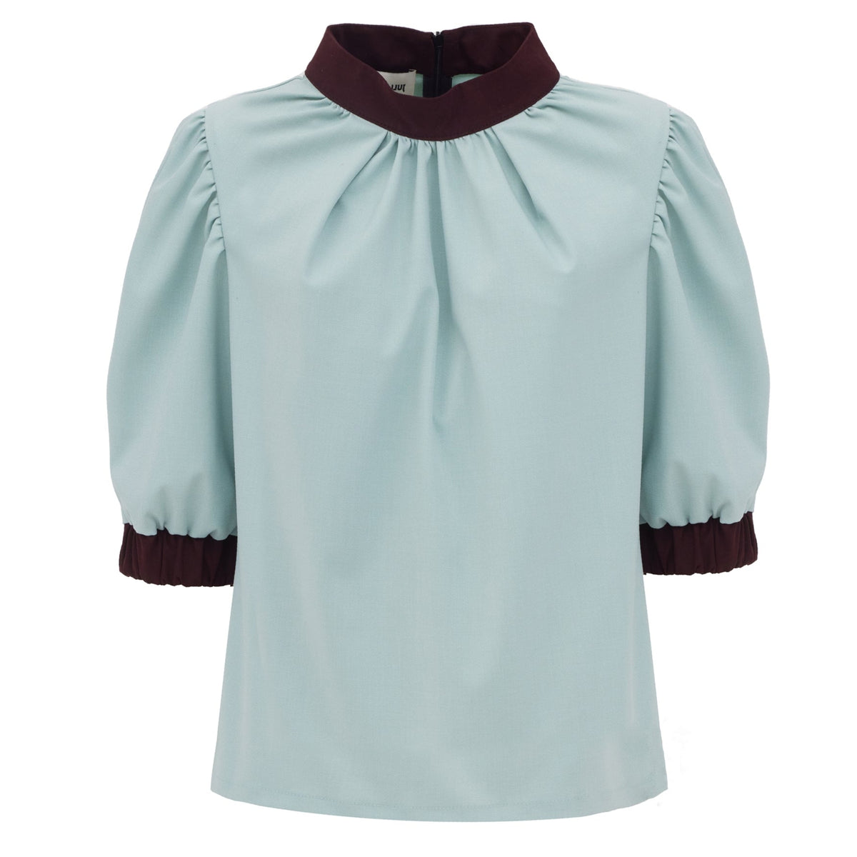 Light blue blouse with maroon accents on a white background