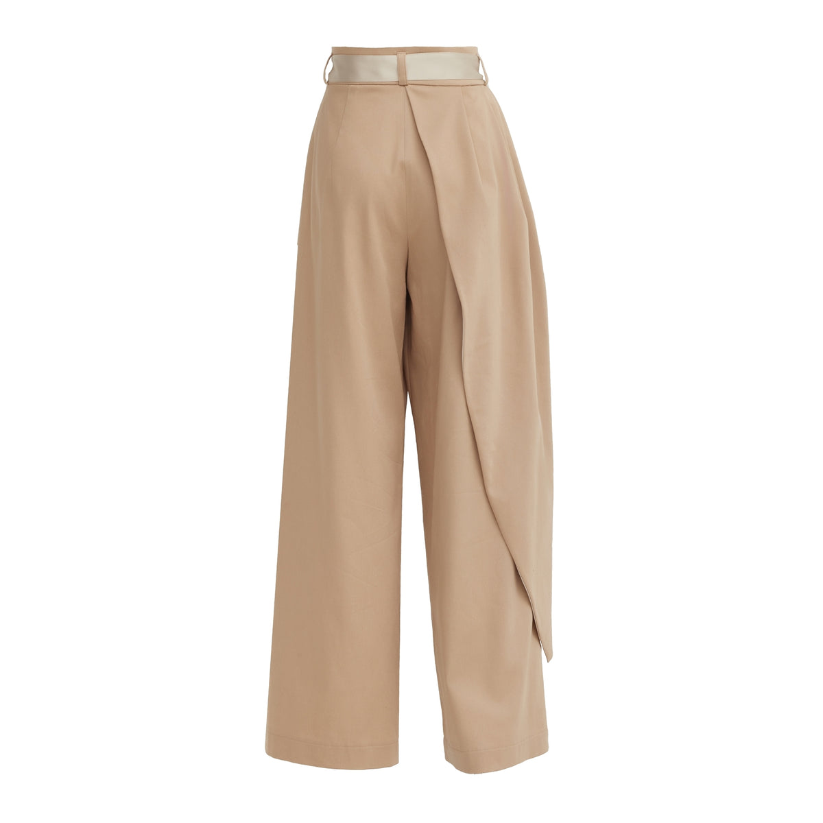 The JULIA ALLERT High-Waist Wrap Trousers in beige feature a high waist, belt detail, and an asymmetrical draped overlay. Shown on a white background.