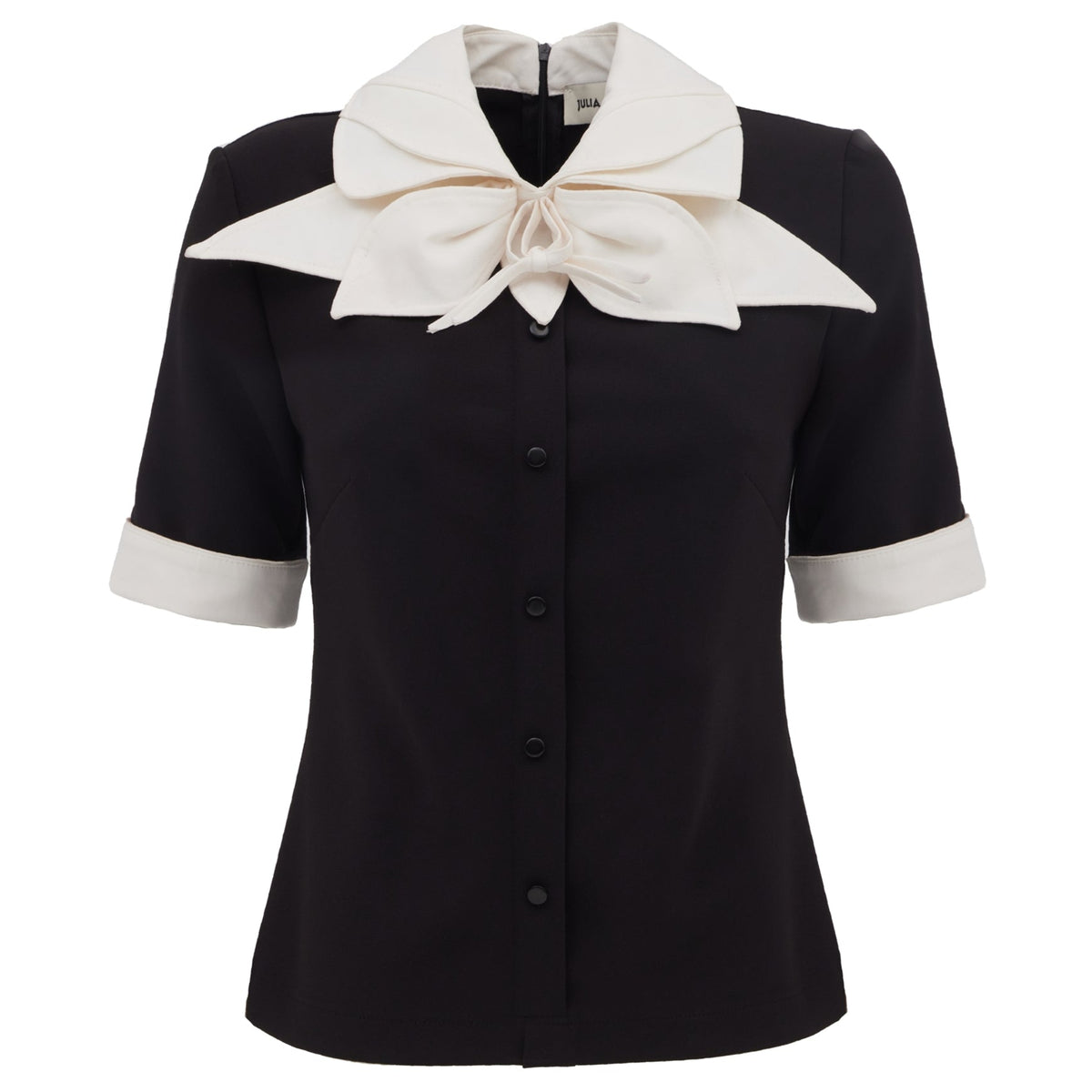 The JULIA ALLERT Short Sleeve Formal Bow Blouse - Black features white cuffs, an oversized contrast bow collar, and a button-down front for an elegant look.