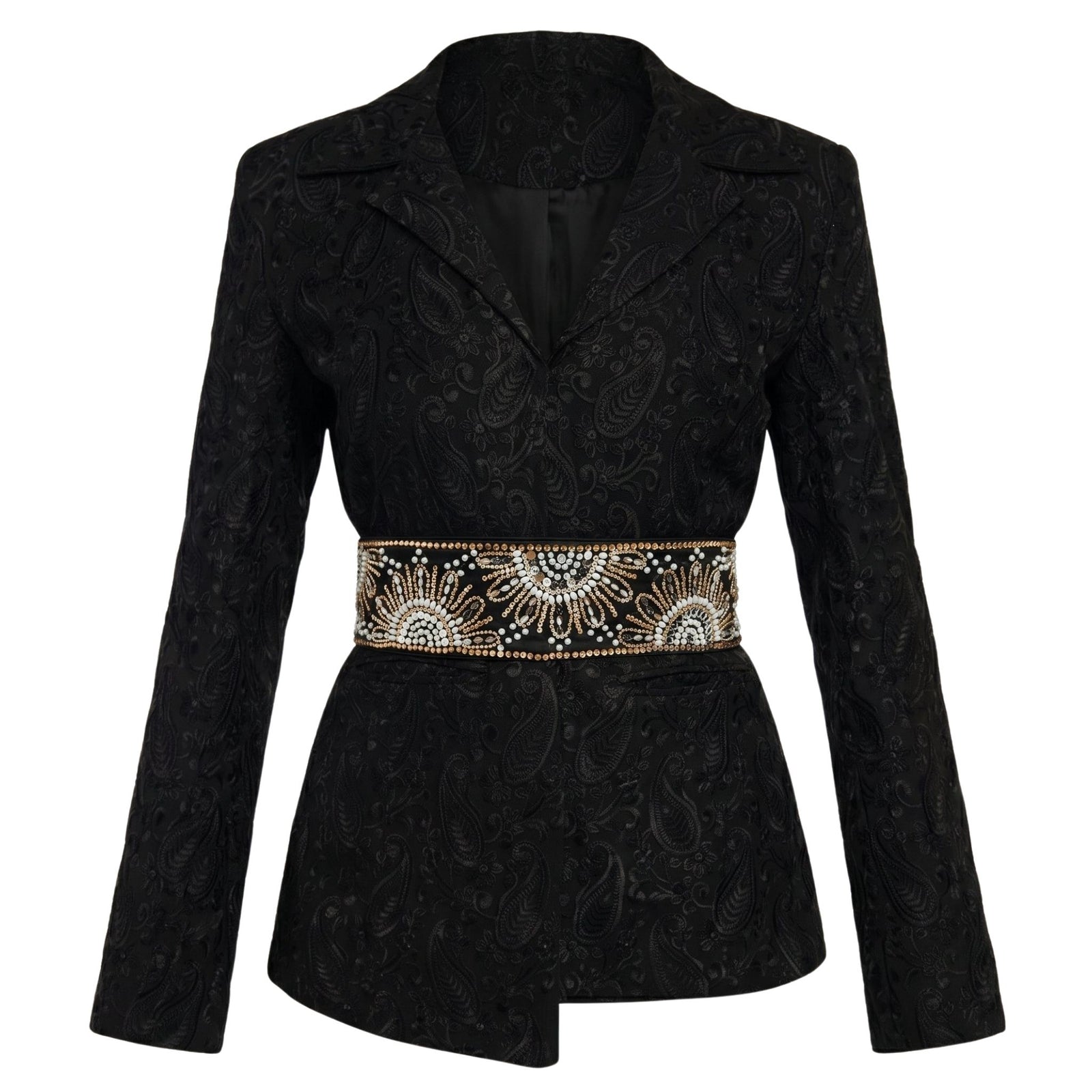 The Black Paisley Textured Blazer by INTERNATIONAL APPEAL features a chic paisley pattern and pairs with an embellished waist belt accented with beadwork and rhinestones for a look of contemporary luxury.