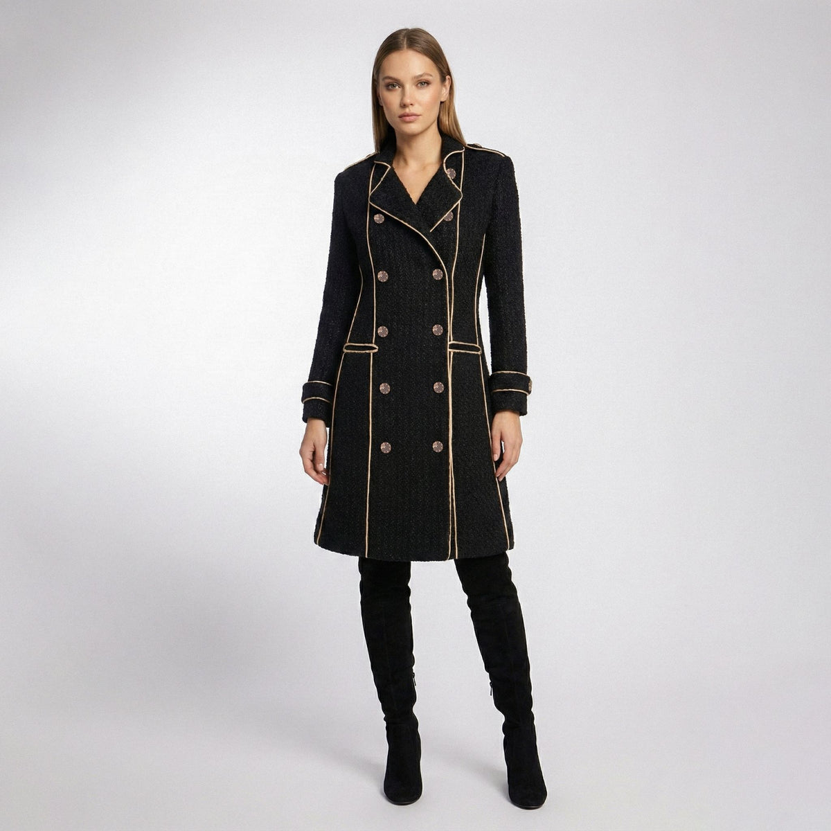 Black coat with gold trim on a white background