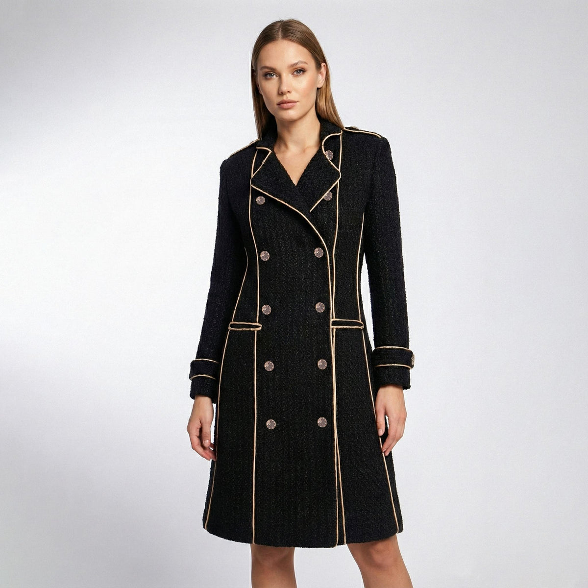 Black coat with gold trim on a white background