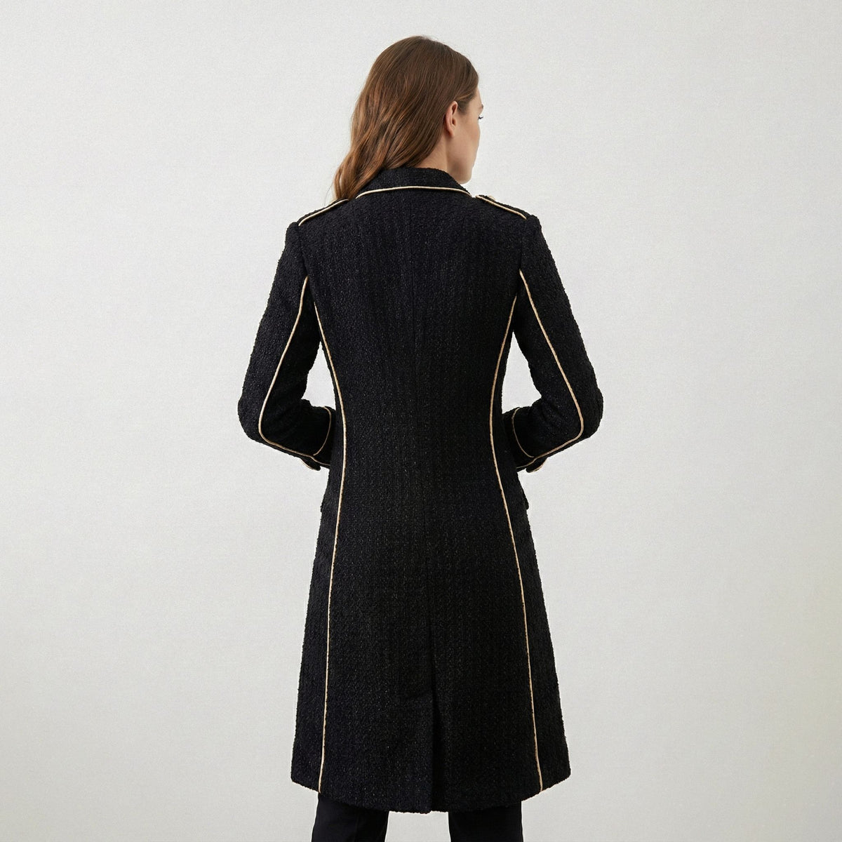 Black coat with gold trim on a white background
