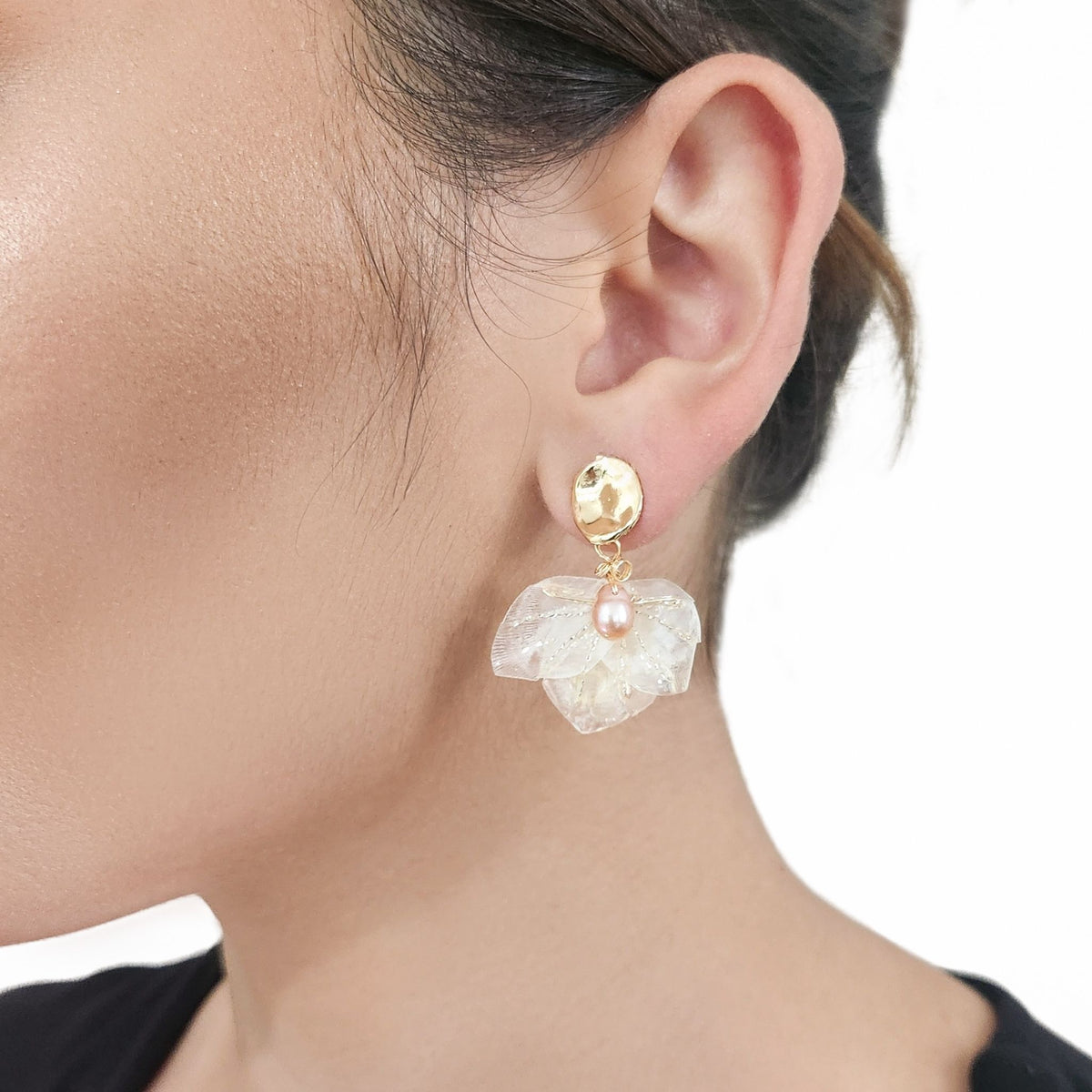 Model ear wearing earcuff  in close up both ears.