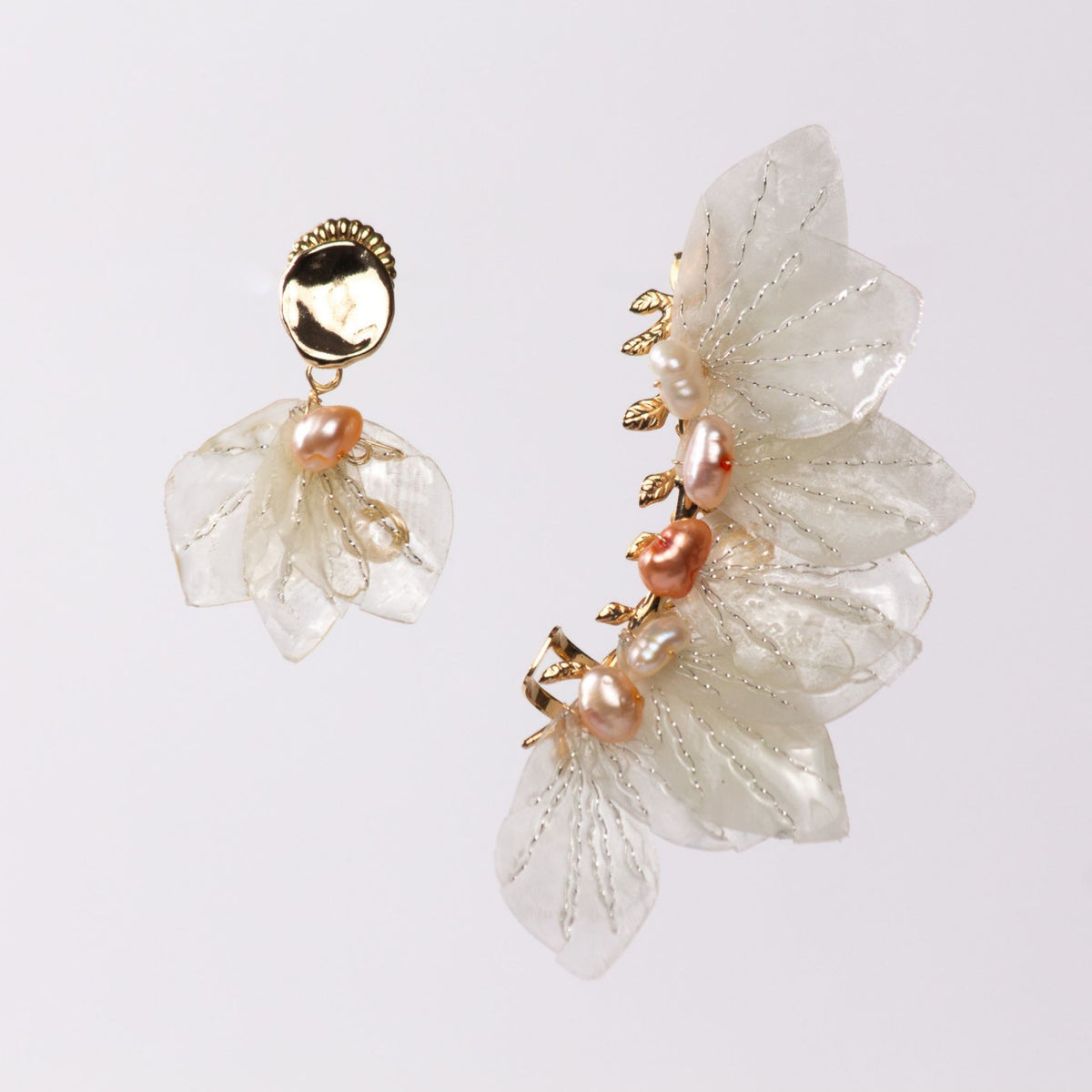 Sealilly earcuff designed by Alma Dos Mares both ears are different.