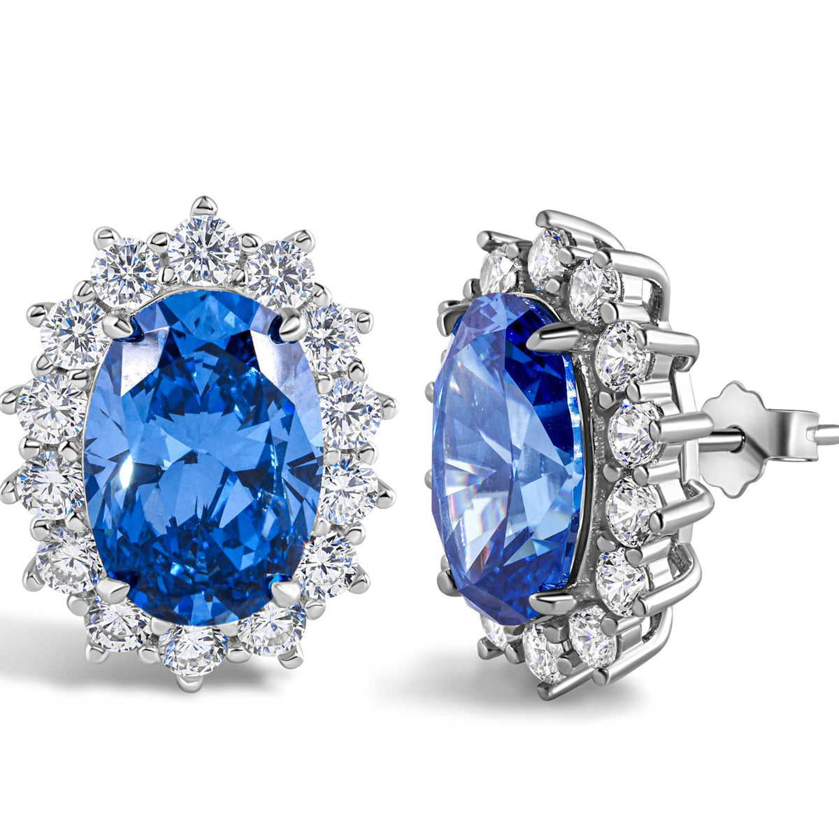 Pair of earrings with blue gemstones and diamond-like stones on a white background