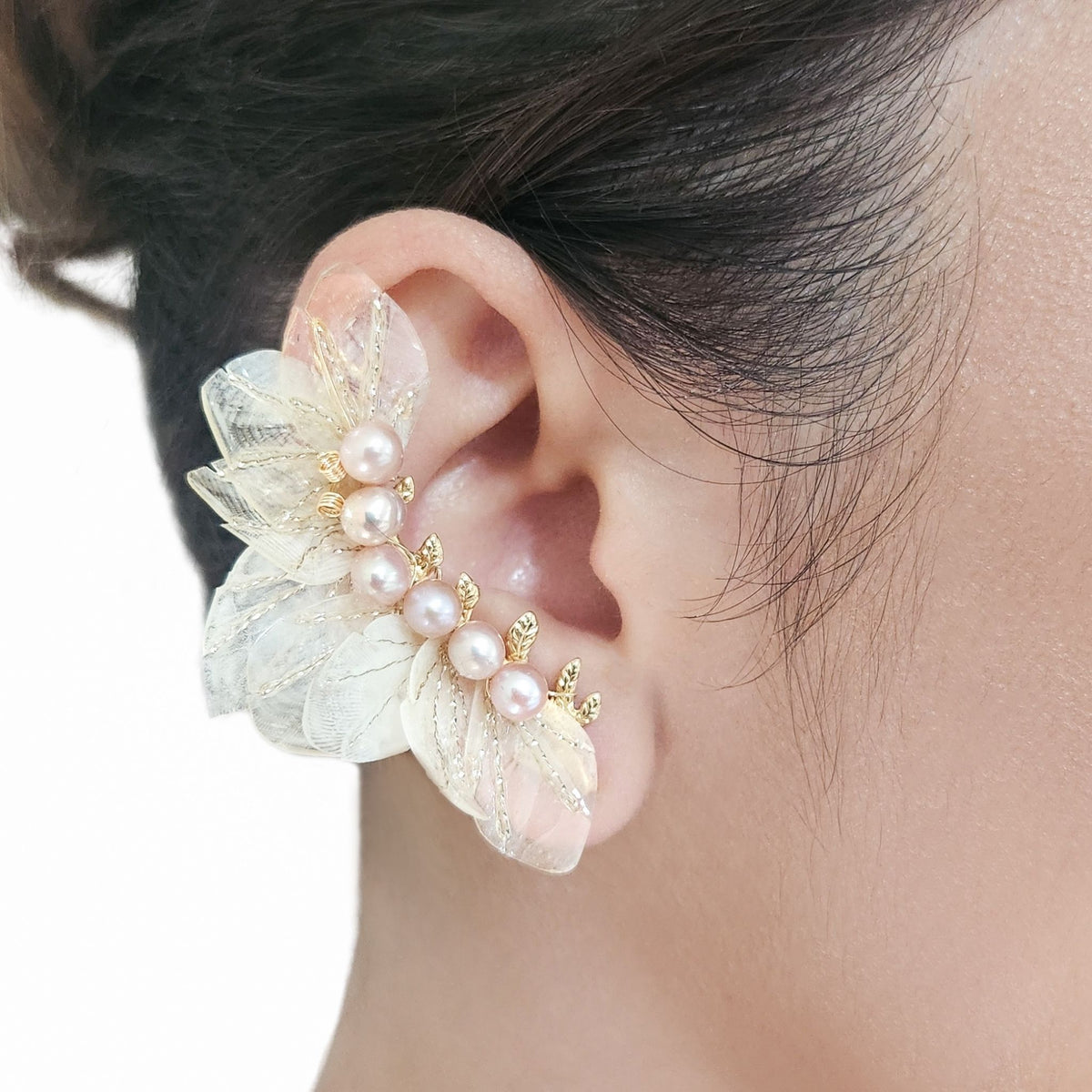 Model ear wearing earcuff  in close up both ears.