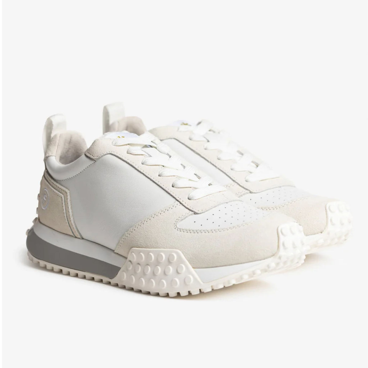 White sneaker with gray sole on a white background