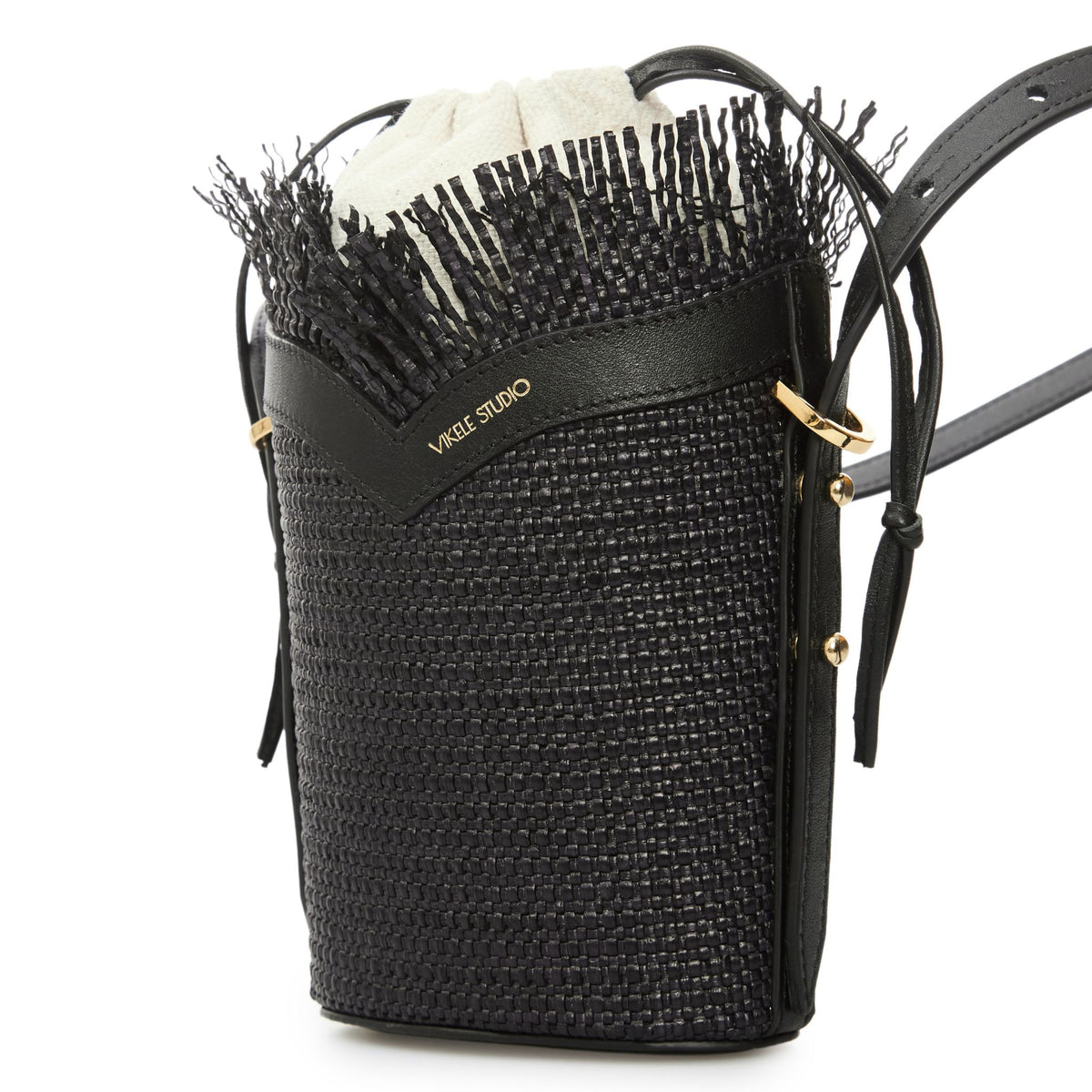 Black woven handbag with fringe detail and visible brand name on a white background