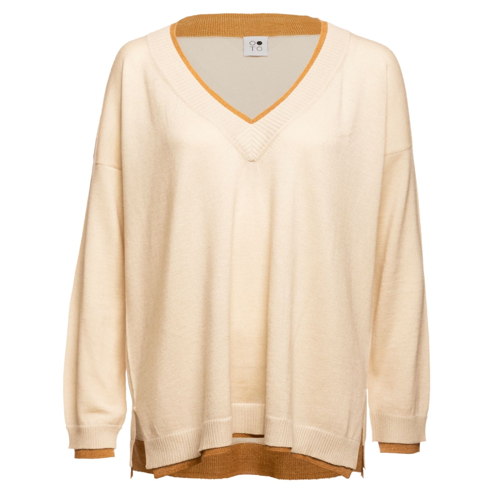 The OO-TO White with Beige Lapis Oversized V-Neck Sweater features a loose fit and contrasting beige trim at the neckline, hem, and cuffs, with visible layered beige underlayers for extra style.