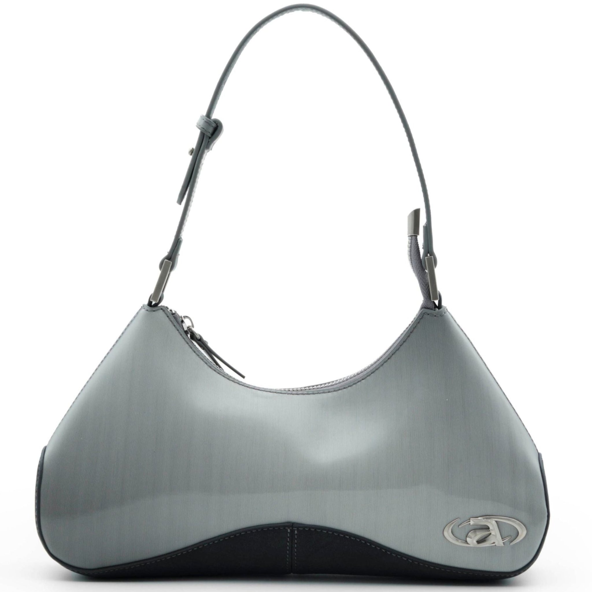 Close-up of Ada crossbody bag with signature metal logo and top zip closure