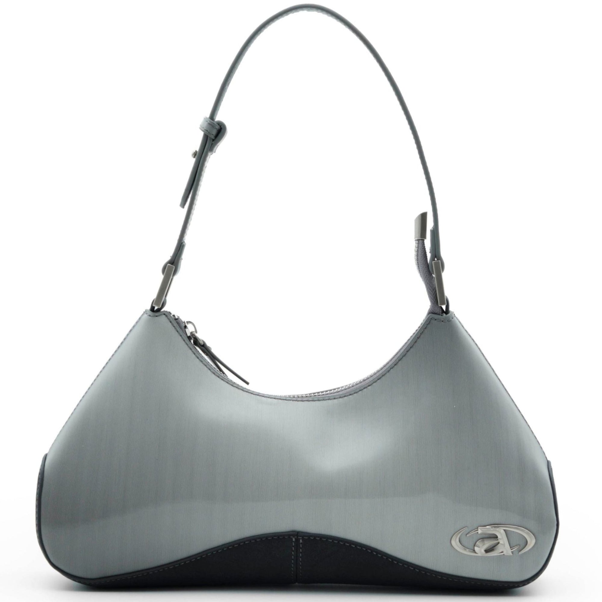 Close-up of Ada crossbody bag with signature metal logo and top zip closure