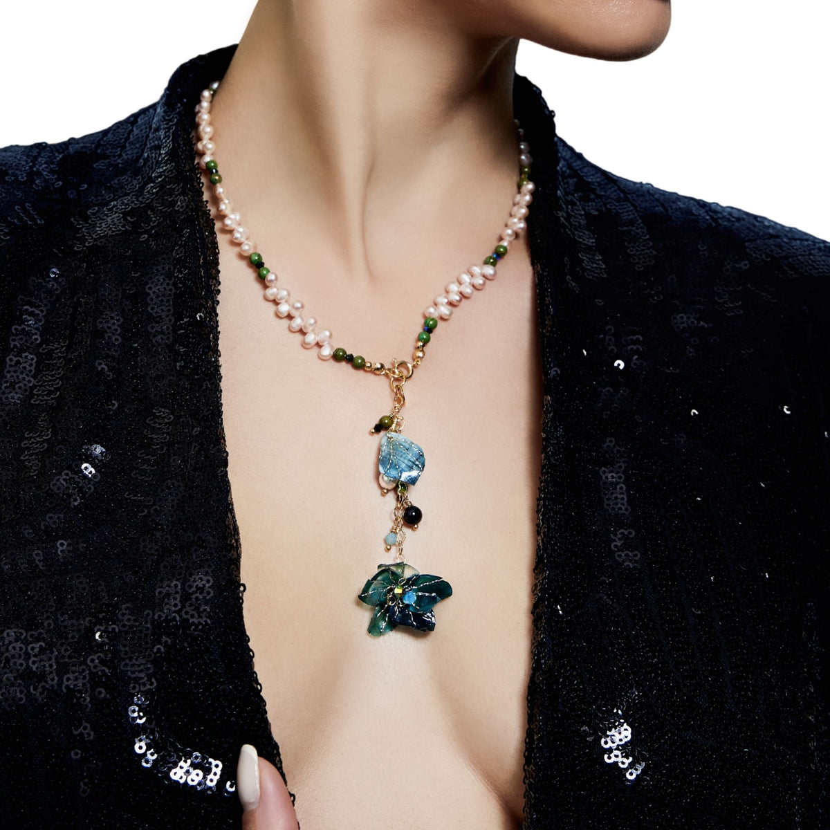 Model chest wearing neckalace in close up