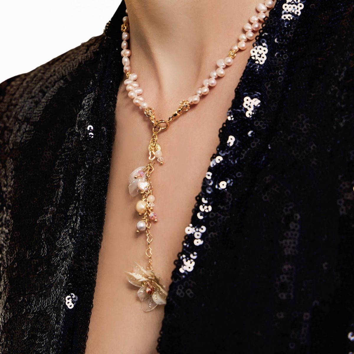 Model chest wearing neckalace in close up