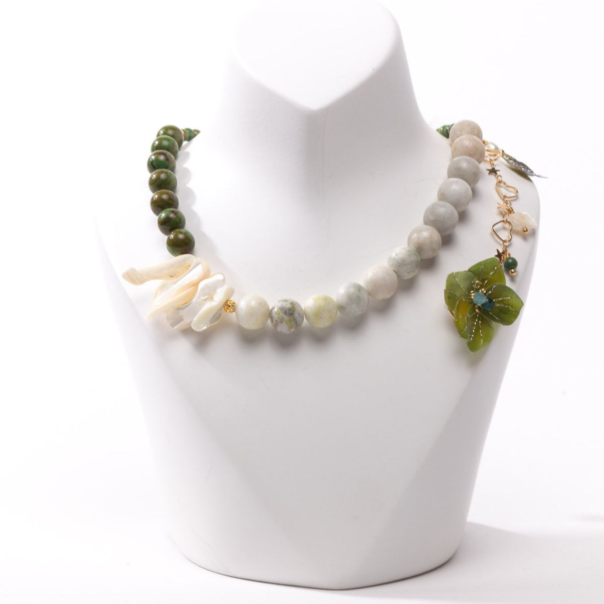 Model chest wearing neckalace in close up