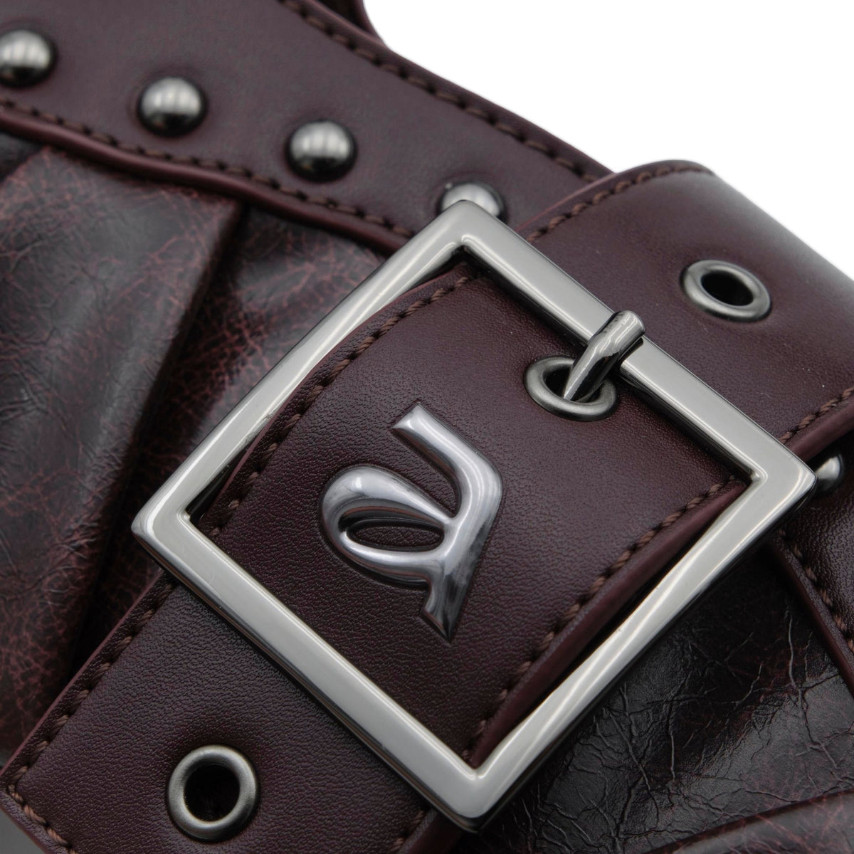 Close-up of a brown leather belt with a silver buckle on a white background