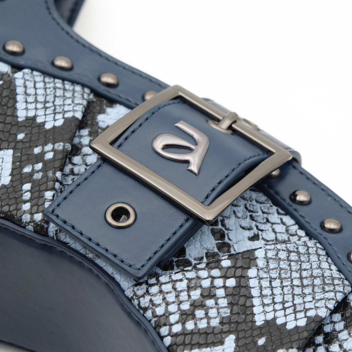 Close-up of a blue leather belt with snake pattern and metal buckle on a white background
