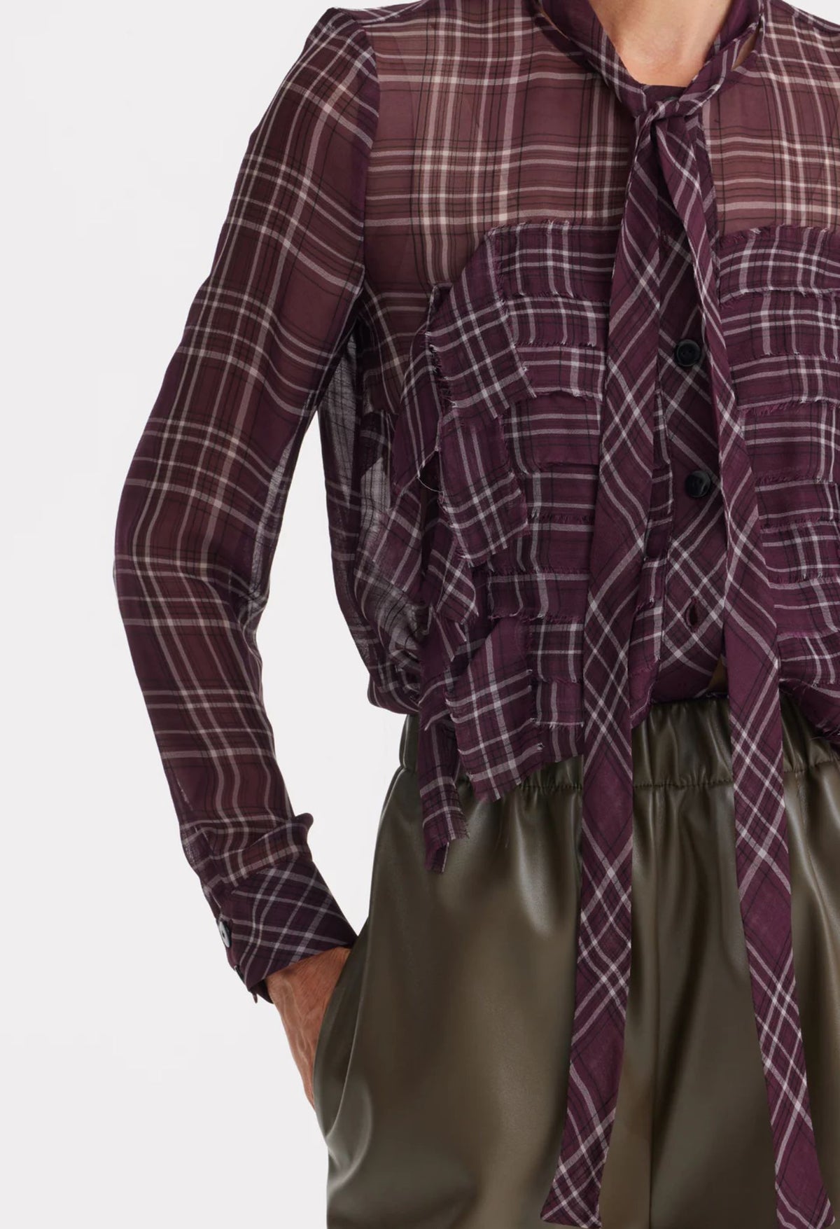 Plaid shirt with a tie and green pants on a white background