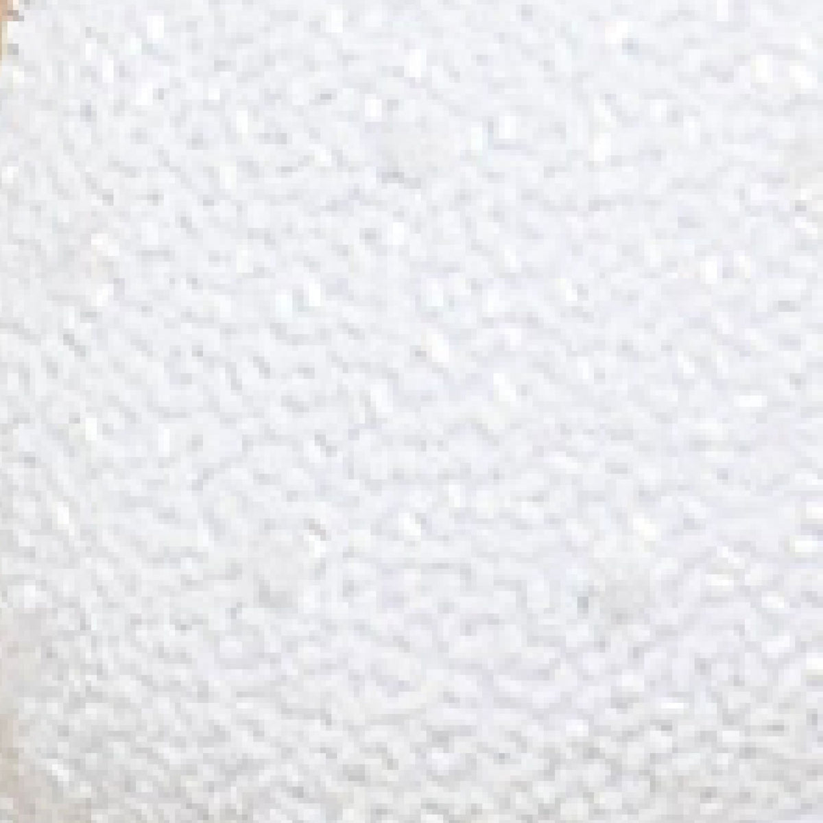 Close-up of the textured white surface of the SELF-ADORE Forever Hand-Beaded Embellished Bikini Bottom, featuring small, round, foam-like beads that evoke artisanal craftsmanship and elegant detailing.